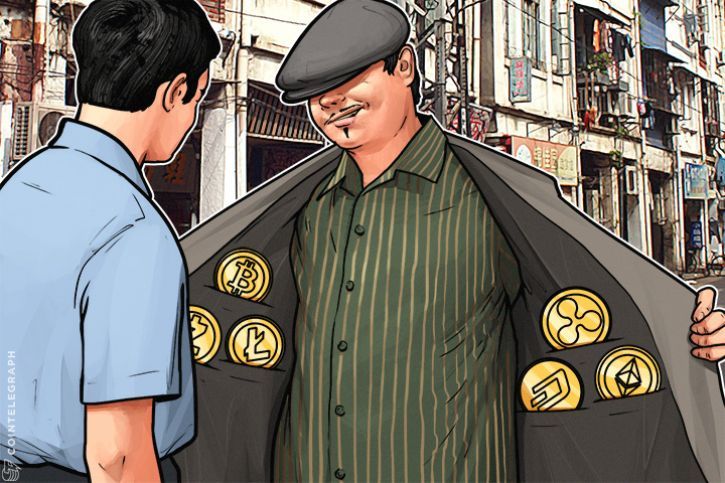 A man selling crypto coins at the bazaar