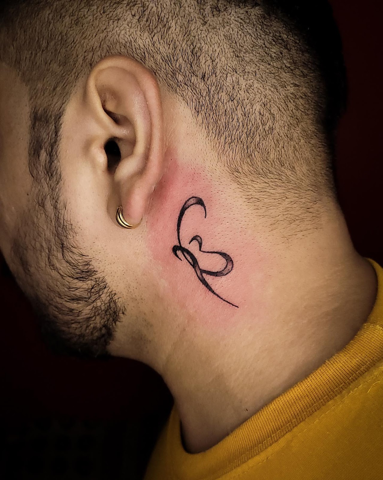 Omkar Behind The Ear Tattoo