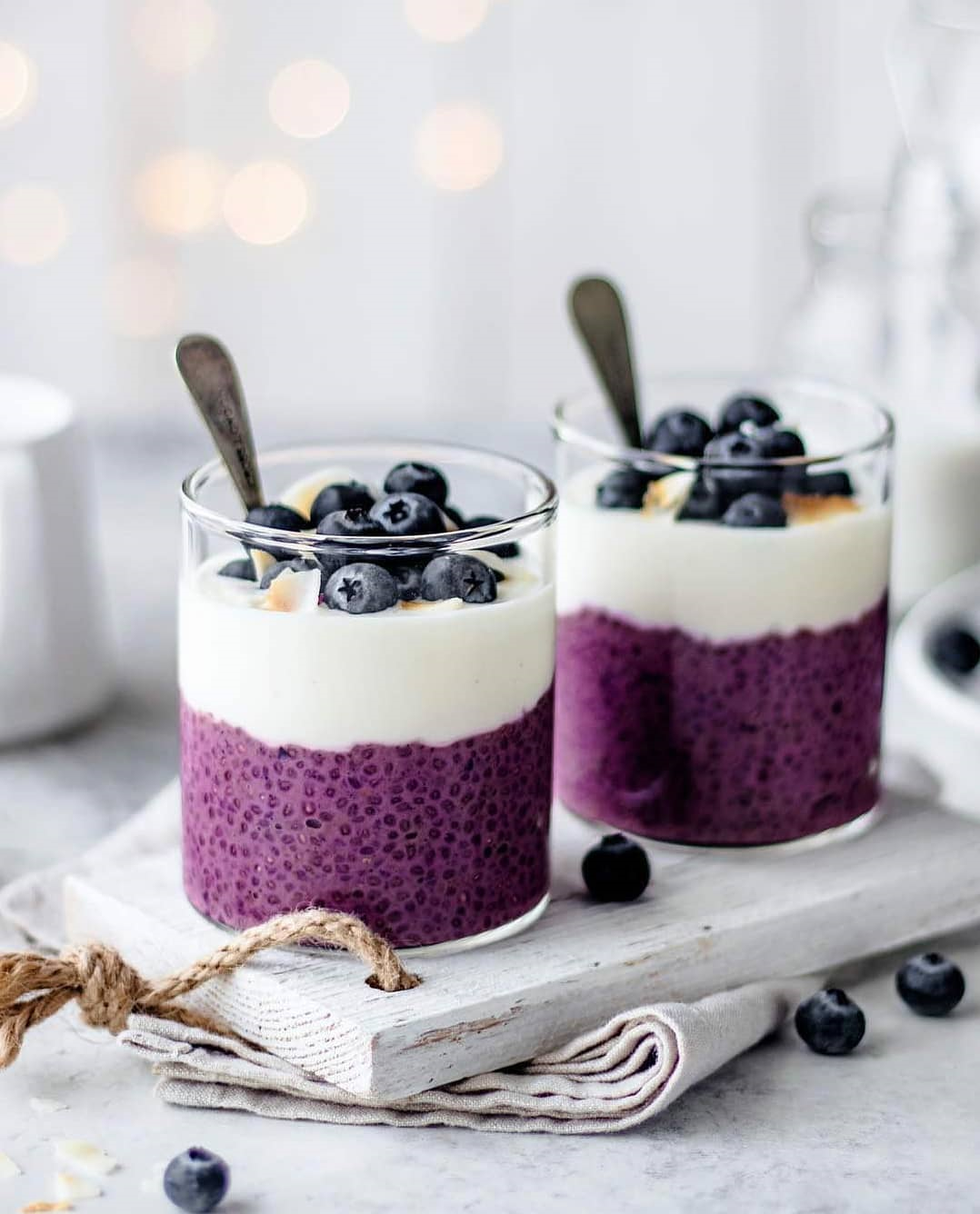 purple chia seed pudding with yoghurt and blue berries