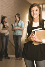 A female student in a hallway