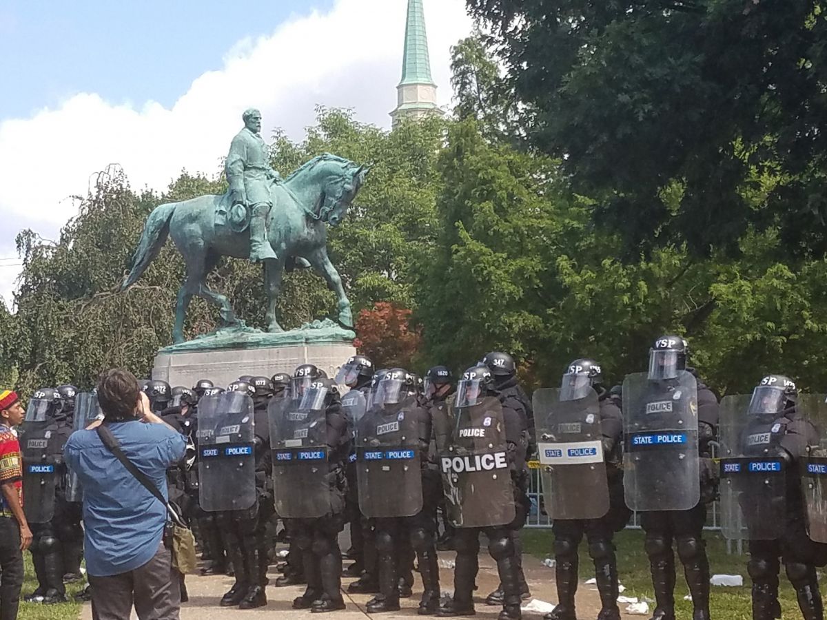 Police guarded the entrance to Emancipation Park in front of the controversial statue of Robert E. Lee, which the city council voted to remove earlier this year. (Photo by Adele Stan)