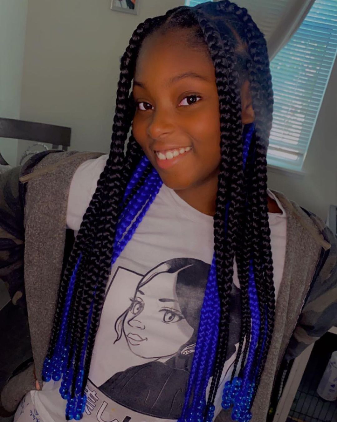 22. Big Black And Blue Knotless Braids With Blue Beads