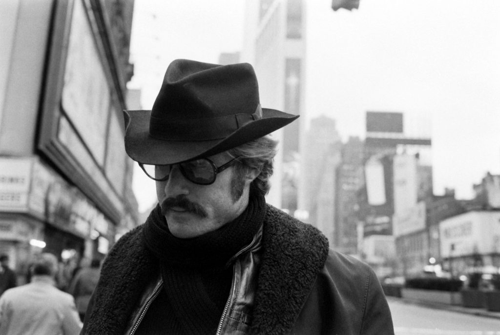Robert Redford in Times Square, between meetings, 1969.