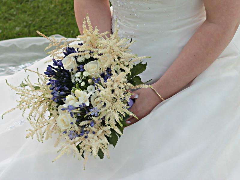 Bride holding her wedding bouquet-Minstrel Court