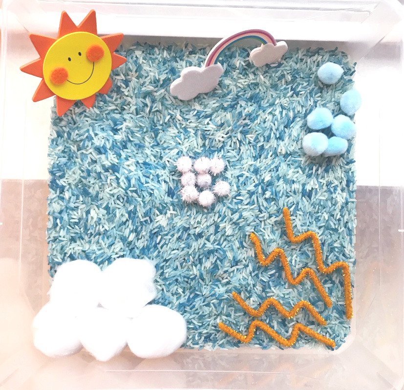 weather sensory bin with rice, cotton balls and pipe cleaners