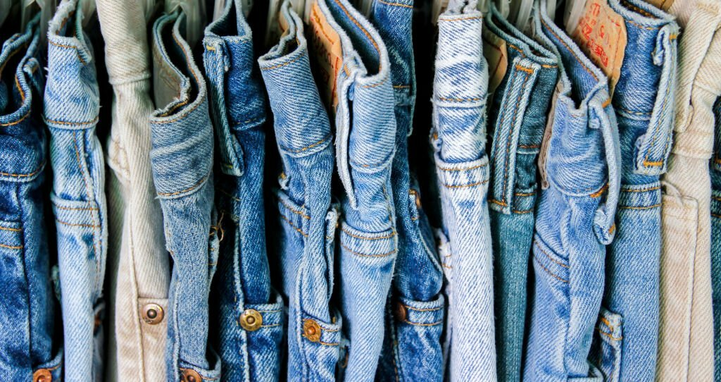 A rack of all kinds of jeans through the history.