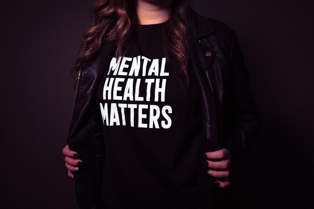 A woman wearing a t-shirt that says mental health matters