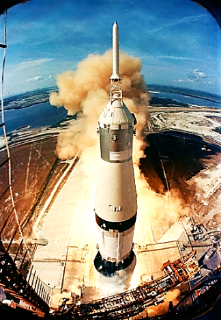 Liftoff of the Saturn V rocket for the Apollo 11 lunar landing mission, with astronauts Neil A. Armstrong, commander; Michael Collins, command module pilot; and Edwin E. Aldrin Jr., lunar module pilot, on board. 