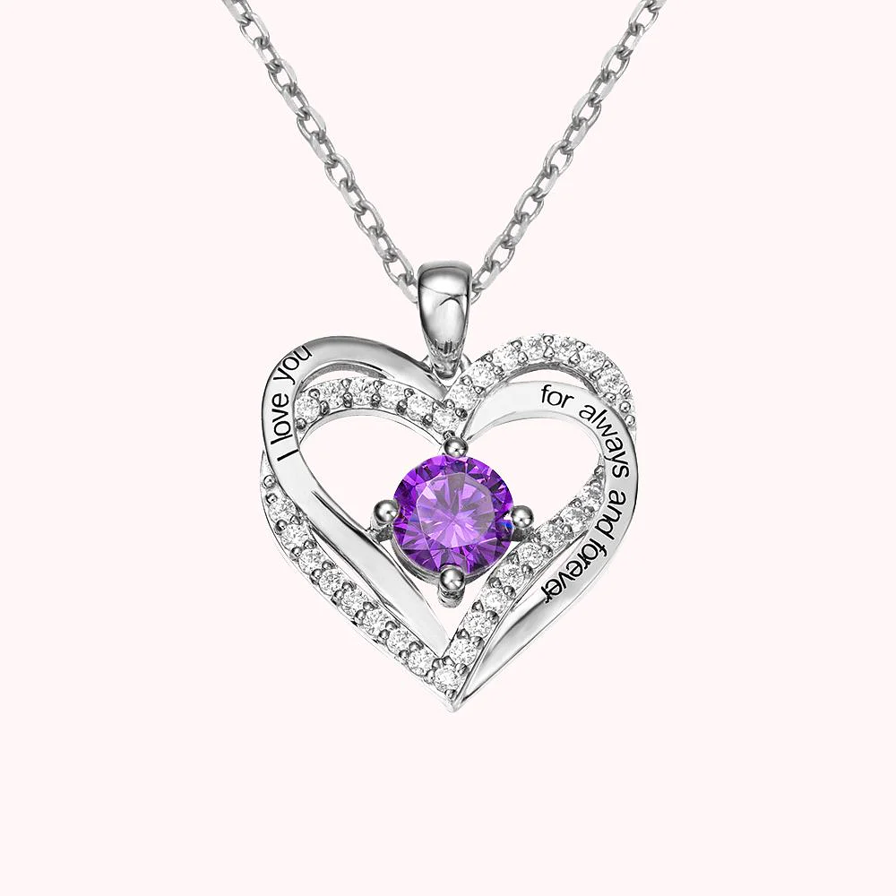 Collier sous la forme de deux cœurs entrecroisés, avec pierres sur l’un et gravures personnalisées sur l’autre.