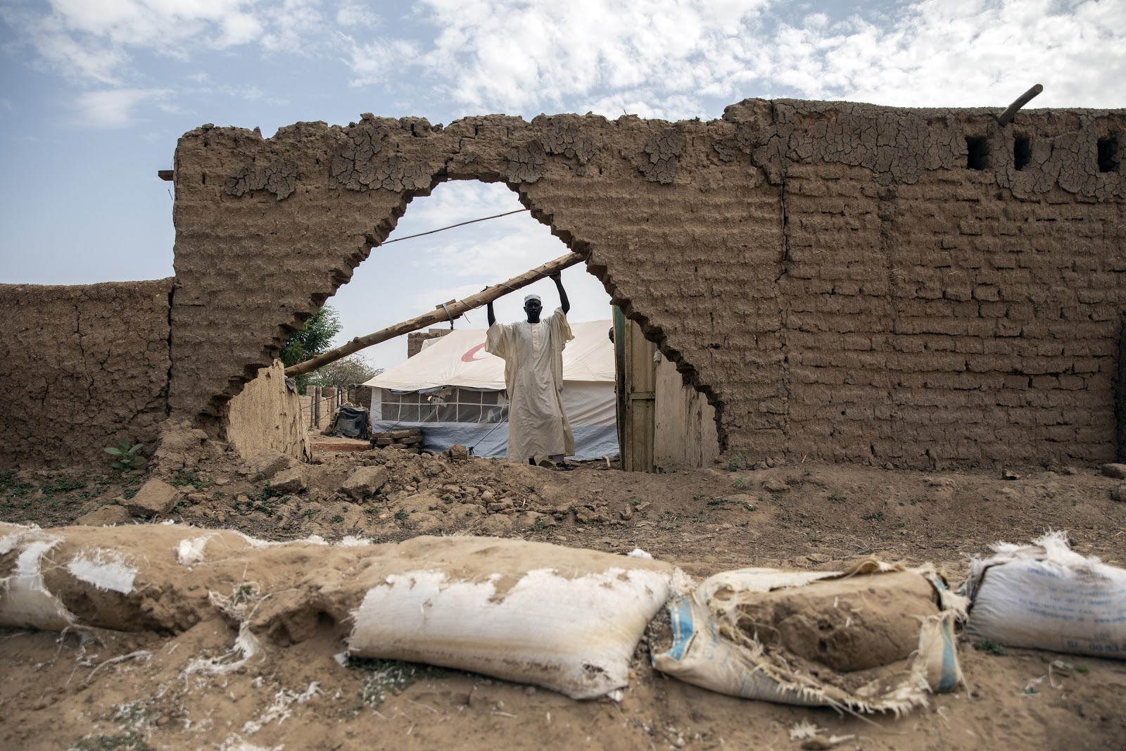 Moussa Khalil in his destroyed house in one of Gabl Awlaya villages in Sudan