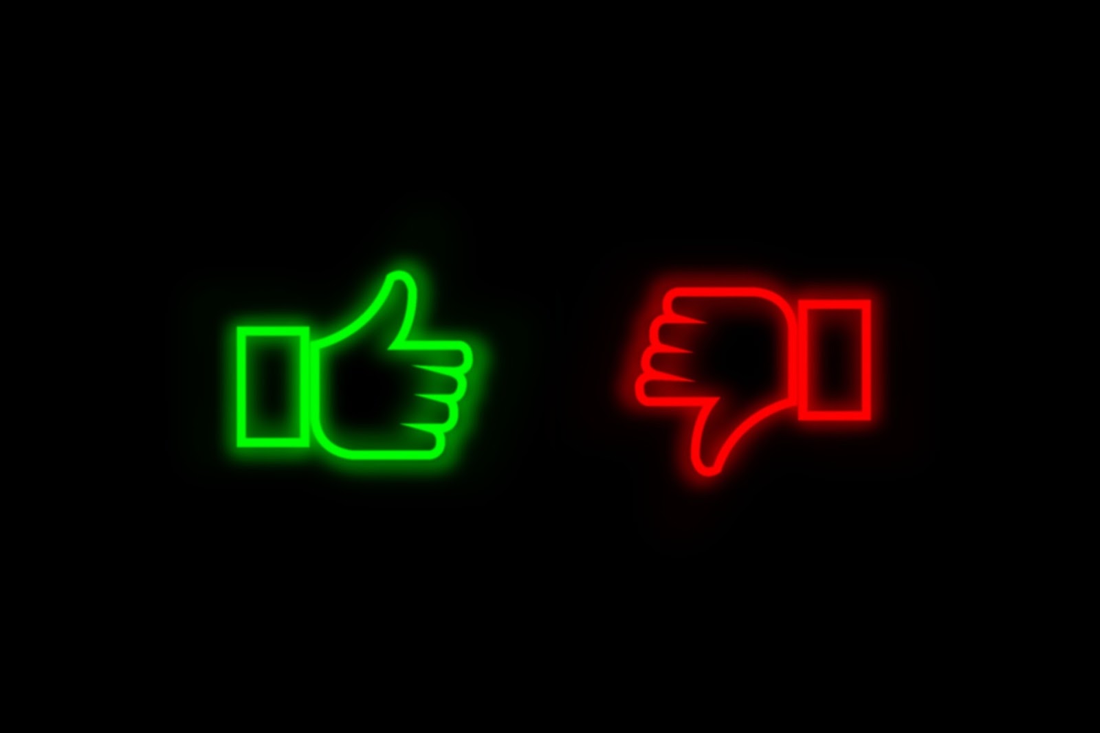A neon green thumb pointing up on the left and a neon read thumb pointing down on the right.