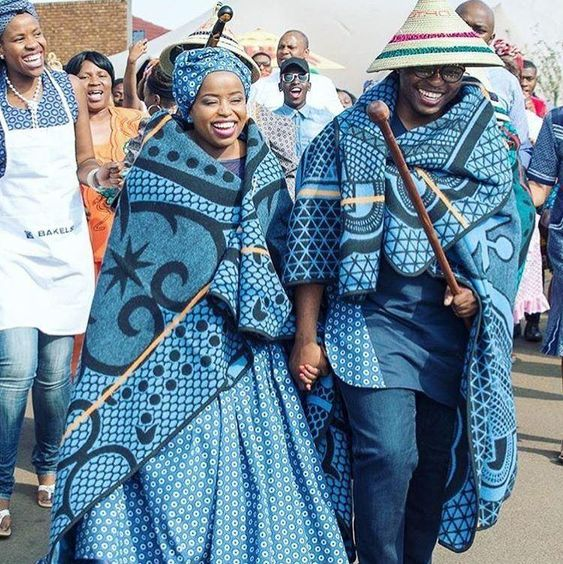 Happy couple wearing traditional Sotho costumes on the street