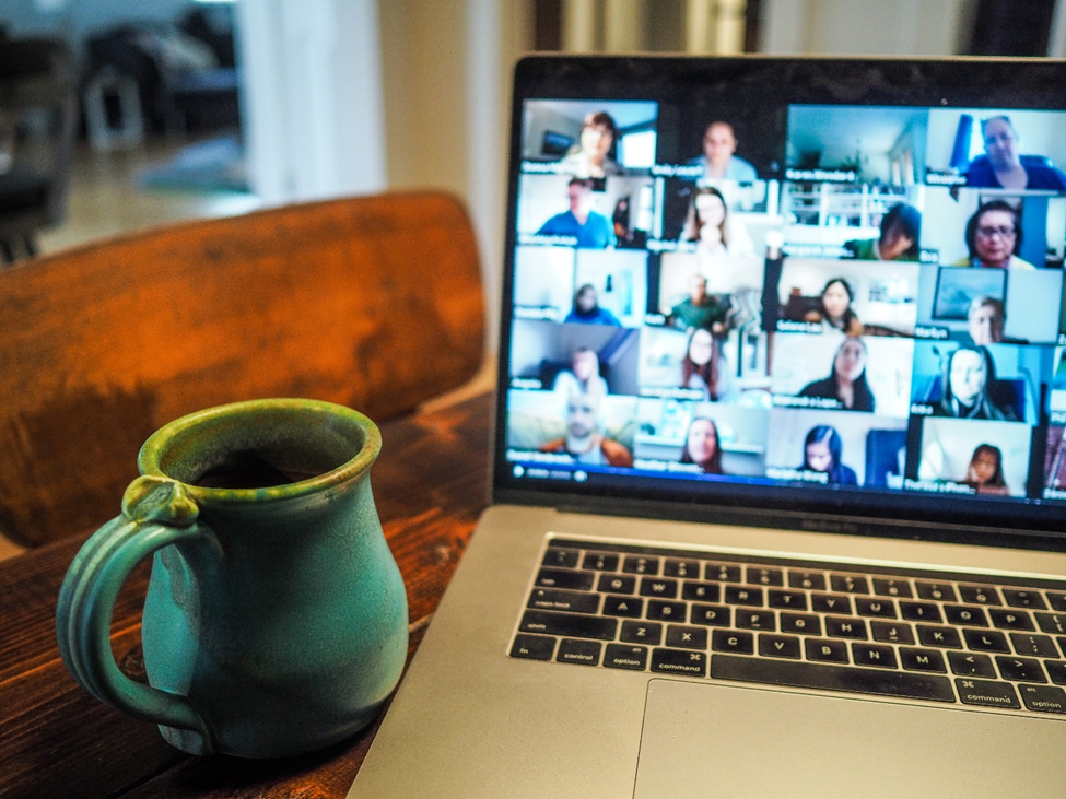 image of a laptop with a video conference going on