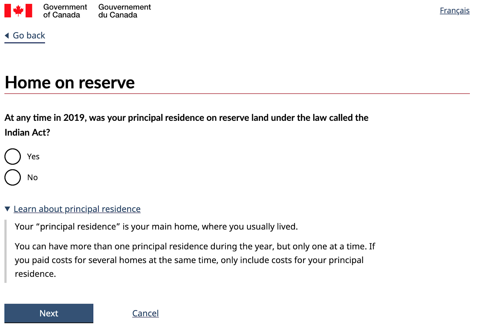 Screenshot of benefit question page titled "Home on reserve." Question "At any time in 2019, was your principal residence on reserve land under the law called the Indian Act?" Yes and No radio buttons. Link titled: Learn about principal residence. Description: Your principal residence is your main home, where you usually lived. You can have more than one principal residence during the year, but only one at a time. If you paid costs for several homes at the same time, only include costs for your principal residence." Next and cancel buttons.