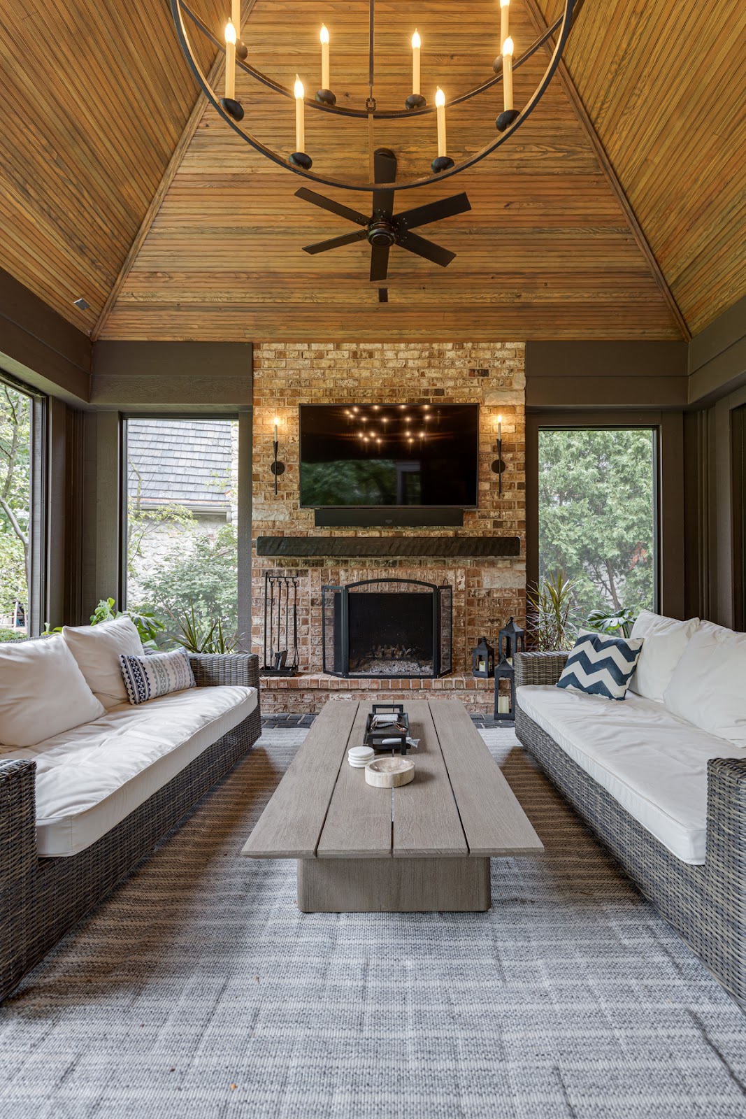 The natural wood beaded vaulted ceilings and wheel chandelier make a grand yet cozy statement.