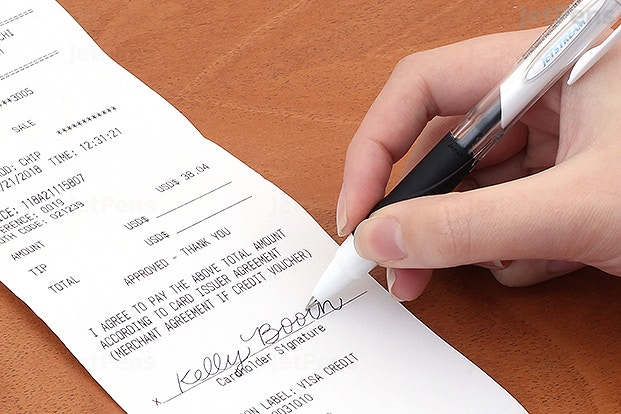 Signing a receipt. 