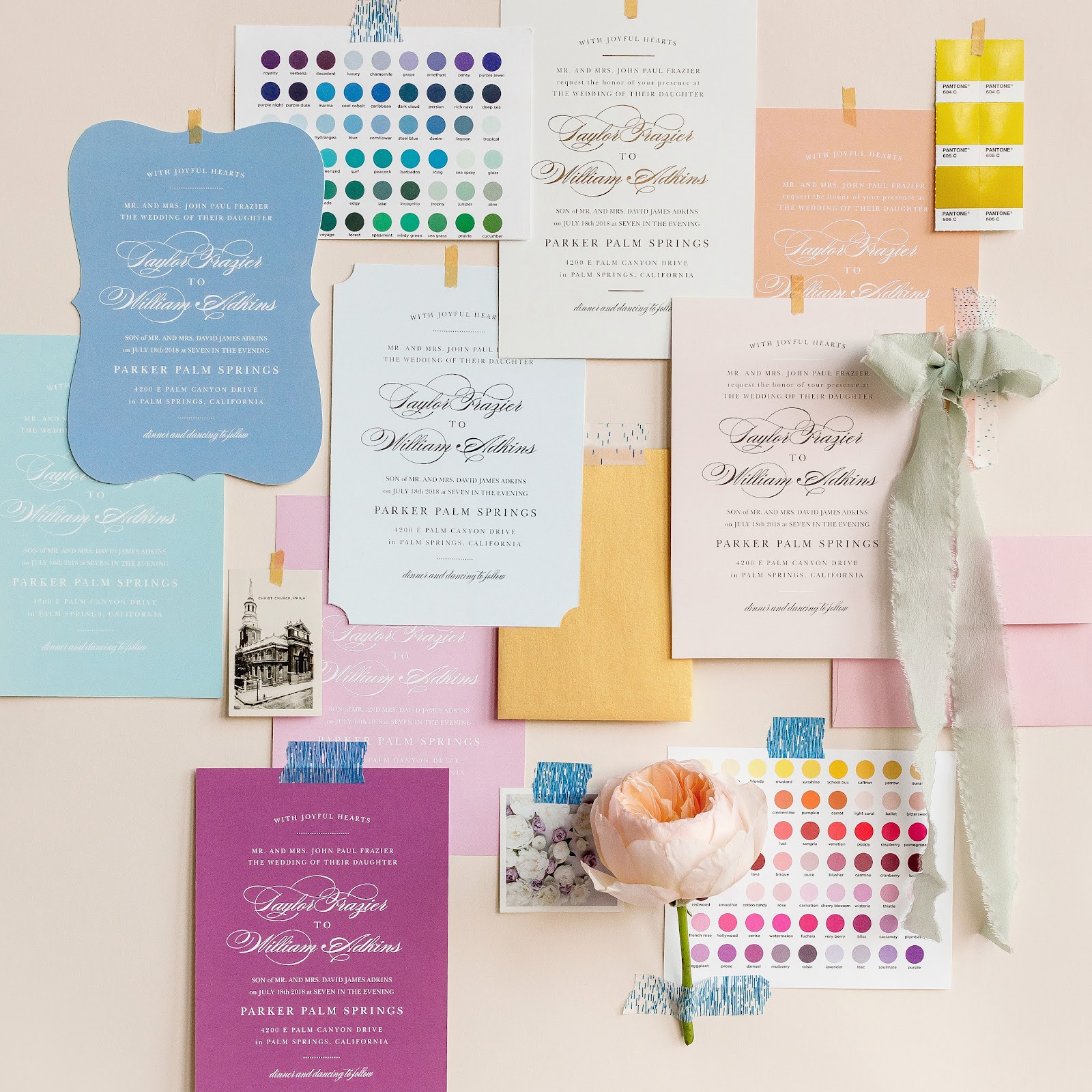 Inspiration board with wedding invitations, color palettes, ribbons and envelopes. 