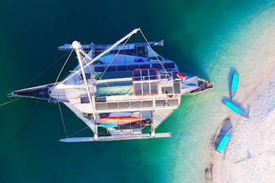 Raja Ampat Snorkeling Adventure Yacht Charter Expeditions Indonesia Top Rated Boat Cruises Big Kanu Big Kanu Snorkel Cruise - SPESIALIS SNORKELING CRUIS DI RAJA AMPAT! Bawah air atau darat, datang dan temukan harta karun dan keindahan kepulauan Raja Ampat melalui kapal pesiar kami yang unik. Perjalanan pesiar snorkeling liveaboard Big Kanu Raja Ampat memberi Anda kesempatan untuk menjelajahi dunia ekosistem bawah laut terkaya   Kano Besar Raja Ampat    Day 1 : Sorong to Waisai  Pada hari pertama pelayaran, direktur pelayaran dan divemaster akan menjemput Anda dari hotel atau bandara dan membawa Anda ke kapal. Feri 2 jam memisahkan Anda dari Waisai, pelabuhan masuk Raja Ampat, tempat kapal menunggu Anda. Begitu berada di atas kapal, bersantailah dan nikmati minuman selamat datang sementara direktur kapal pesiar memberi pengarahan kepada Anda tentang keselamatan dan peraturan di atas kapal. Setelah pengarahan singkat, duduklah di kabin Anda dan temukan rumah baru Anda sambil menunggu bel mengumumkan makan siang. Setelah makan, Anda akan memiliki waktu istirahat sebelum pergi ke salah satu pantai paradisiak pertama Anda untuk penyelaman snorkeling pertama. Nanti kita angkat sauh untuk melanjutkan ke tujuan selanjutnya.  Hari 2 : Pulau Friwen & Kri  Kami akan membuang jangkar di depan Pulau Urai untuk salah satu spot snorkeling rahasia kami. Saat Anda mendekati pantai yang mewah, temukan terumbu karang yang kaya dengan karang keras warna-warni, ikan kakatua, batfish, ahli bedah, dan bahkan mungkin kura-kura atau hiu pertama Anda. Untuk aktivitas kedua, kita akan menginjakkan kaki di Pulau Friwen dimana Anda akan mengunjungi desa khas Raja Ampat. Sesi snorkeling lainnya akan membawa Anda menyusuri dinding sedalam 20 meter yang dipenuhi anemon dan karang merah cerah. Setelah makan siang, Anda dapat menjelajahi Pulau Kri untuk snorkeling lagi! Barracuda, Trevally berkepala besar, hiu karang, dan ikan yang tak terhitung jumlahnya… Di penghujung hari, kapal akan berlabuh di Teluk Yenbuba. Matahari terbenam pertama Anda di geladak akan memungkinkan Anda melihat lumba-lumba atau ikan lainnya.      Hari 3 : Pulau Mansuar   Bangunlah di kawasan sublim Teluk Yenbuba dan awali hari Anda dengan sesi snorkeling di depan desa Yenbuba, ponton yang akan Anda kunjungi setelahnya! Di pilar kayu ponton ini tumbuh gorgonian dan karang lunak lainnya sementara sweetlips oriental, carrangues dan ikan prajurit berkumpul, mencari perlindungan di bangunan yang terendam ini. Snorkeling kedua Anda sudah sangat dekat, di sudut Pulau Mansuar. Melompat ke arus di antara jack, barakuda, fusiliers dan ikan lainnya dan melayang di atas taman karang yang indah di mana kura-kura, pari dan hiu biasa terlihat. Setelah makan siang, Anda akan melakukan penyelaman ketiga di Tanjung Putus. Segera setelah Anda kembali ke kapal, kami akan menuju ke Wayag.      Hari 4: Kepulauan Wayag     Hari ini didedikasikan untuk yang luar biasa dan unik Wayag Kepulauan. Lingkungan paradisiak yang tak tersentuh, topografi darat dan laut yang luar biasa, biarkan diri Anda terbawa oleh keajaiban tempat itu. Jelajahi kepulauan dengan speedboat untuk mengukur kemegahannya, mendaki ke puncak Gunung Pindito untuk mengukur luasnya dan menyelam di sekitar bentang alamnya atau naik kayak untuk merenungkan alamnya. Jika kondisi memungkinkan, Anda akan menikmati BBQ di pantai pribadi kami. Setelah makan malam yang tak terlupakan dalam suasana impian, kapal akan berlayar ke Teluk Aljui.      Hari 5 : Pulau Wofoh    Selamat datang di Taman Jurassic. Anda bangun dikelilingi oleh alam yang subur ini dengan suara kicau burung yang merayakan awal hari. Tur speed boat disiapkan untuk Anda pagi ini. Nikmati pelayaran istimewa yang luar biasa sebelum kembali ke Pulau Wofoh di mana Anda akan melakukan penyelaman pertama Anda di taman karang yang dangkal atau di sepanjang dinding yang dipenuhi kehidupan, sesuai keinginan Anda. Tempat ini juga cocok untuk bermain kayak dan mendayung. Terlindung dari arus, nikmati ketenangan dan kesunyian tempat ajaib ini. Sesi snorkeling lainnya menanti Anda di Yeben, sebuah pulau terpencil yang dikelilingi terumbu karang di mana hampir selalu ada hiu dan tuna. Kami akan bermalam di sini sebelum berlayar ke Pulau Pyanemo pagi-pagi sekali.        Hari 6 : Kepulauan Pyanemo    Selamat datang di Pyanemo, salah satu tempat paling terkenal di Raja Ampat. Snorkeling yang luar biasa di sekitar pulau Melissa's Garden, Batu Rufus atau bahkan Keruo Channel menanti Anda. Amati ikan Napoleon besar, Barakuda, hiu, dan ribuan ikan berwarna-warni di taman karang yang menakjubkan dengan topografi yang bervariasi. Dataran tinggi, dinding, terowongan, semua yang ada di sini dibuat untuk memanjakan mata. Di penghujung hari, Anda akan turun ke darat untuk bertamasya singkat ke salah satu tempat pengamatan paling terkenal di nusantara. Sementara sinar matahari memantulkan keindahan matahari terbenamnya, kagumi konfigurasi alami pulau-pulau Pyanemo dengan Phinisi yang indah sebagai latar belakang, menunggu Anda kembali ke kapal.      Day 7 : Arborek & Mioskon Island    Pagi ini, Anda akan melakukan snorkeling dive di kawasan Arborek dengan tujuan bertemu dengan pari manta yang terkenal anggun dan mengesankan. Biarkan diri Anda melayang di atas salah satu tempat pembersihan tempat raksasa agung ini datang untuk berenang dengan damai. Untuk penyelaman kedua Anda, kami akan kembali ke Pulau Mansuar untuk berhenti di depan desa Saundarek. Kehidupan di sini berlimpah, di dekat dermaga desa, puluhan spesies berevolusi di bangku sempit untuk menciptakan tontonan kehidupan yang menakjubkan. Kerang raksasa besar hidup di bawah dermaga, menyenangkan bagi fotografer. Sore hari, kapal akan parkir di dekat Miosko Pulau untuk sesi snorkeling terakhir. Di atas karang yang dangkal, ribuan ikan kecil bergerak dengan kecepatan cahaya. Tentunya satu pengalaman terakhir yang tidak akan Anda lupakan. Di penghujung hari, nikmati matahari terbenam yang indah dan makan malam yang tenang di tempat berlindung Miosko Pulau. Setelah gelap, kami akan berlayar kembali ke Sorong dan Anda akan tiba di pelabuhan di pagi hari.      Day 8 : Disembarkation in Sorong    Tergantung pada jadwal penerbangan Anda, penjemputan Anda telah diatur. Setelah sarapan terakhir yang lezat di atas kapal, foto kenang-kenangan dengan seluruh kru dan berbagi kenangan hangat, saatnya untuk mengucapkan selamat tinggal dan check-out.  * Harap diperhatikan bahwa rencana perjalanan dan layanan yang disebutkan di atas dapat diubah jika force majeure, keadaan yang tidak terduga atau tidak dapat dihindari mengharuskan kapten atau awak kapal untuk melakukannya. Namun, kami akan selalu melakukan yang terbaik untuk tetap mengikuti program ini.   Ekspedisi Snorkeling Raja Ampat Ekspedisi Snorkeling Raja Ampat adalah perjalanan sejati ke surga di Bumi. Bentang alam yang megah dan dunia bawah laut yang hidup menjadikan tempat ini benar-benar salah satu bagian terindah dan berbakat alami di planet ini. Pelayaran sekali seumur hidup ini akan membawa Anda melewati labirin selat yang menawan dan megah. Berpesiar di tepi samudra mengikis lanskap garis pantai terjal dan curam dari hutan hujan perawan yang rimbun dan rimbun. Dekati garis pantai untuk menemukan pantai dan laguna tersembunyi untuk hari santai yang menyenangkan. Raja Ampat adalah ibu kota keanekaragaman hayati laut. Sekitar tujuh puluh persen dari spesies karang yang tercatat di planet ini hidup di sini. Alhasil, tempat ini menjadi destinasi biodiversitas laut nomor satu di dunia. Temukan banyak spesies ikan dan berenanglah bersama ikan pari manta yang megah sebagai daya tariknya Sewa kapal Raja Ampat. Wilayah ini merupakan tujuan menyelam terbaik. Namun bukan berarti hanya mereka yang pandai menyelam saja yang bisa menikmati keanekaragaman laut ini. Anda akan takjub bahwa sekitar sembilan puluh persen biota laut hidup 4 meter di bawah permukaan air.    KEBERANGKATAN DARI WAISAI | HARI 1   Berangkat dari Waisai untuk Pesiar Petualangan Raja Ampat Anda – hanya naik kapal cepat singkat dari Sorong. Setelah duduk di atas kapal, perjalanan akan dimulai dengan minuman selamat datang yang menyegarkan, pengenalan singkat tentang kapal dan awak kapal, serta pengarahan keselamatan. Setelah itu, kita mulai dengan mengunjungi situs Snorkeling pertama kita, Miskon. Sore hari, kami berlayar menuju Selat Dampier, sambil menyeruput minuman saat matahari terbenam dan bersantai di geladak. Bermalam tambat di area Dampier Straight.  EKSPLORASI UDARA DAN LAUT DI SELAT DAMPIER |HARI 2   Selat Dampier adalah keindahan sejati dengan pantai pasir putihnya, perairan biru kehijauan sebening kristal, terumbu warna-warni, dan latar belakang hutan hujan yang rimbun. Hari ini akan dimulai dengan perjalanan pagi untuk melihat burung Tapokreng yang indah. Sepanjang jalan Anda akan ditemani oleh pemandu lokal Papua saat Anda mengamati burung-burung ini saat tinggal di habitat aslinya di alam liar. Selain Kakatua, Burung Enggang Besar, Fregat, Elang, dan Burung Beo Berwarna-warni yang menukik di atas kepala, Anda akan memiliki peluang bagus untuk melihat Burung Cendrawasih yang eksotis dan langka. Selat Dampier dengan cepat dikenal sebagai tempat dengan pemandangan snorkeling paling spektakuler di kawasan ini.  KEHIDUPAN DESA LOKAL DI ARBOREK | HARI KE-3  Pagi-pagi sekali, yacht berangkat menuju Arborek. Berlayar saat fajar menawarkan pengalaman yang indah dan unik untuk menyeruput kopi atau teh panas sambil mendengarkan alunan musik dari berbagai jenis burung eksotis. Ekspedisi snorkeling Anda membawa Anda ke Lereng Manta atau Manta Sandy – situs terkenal karena merupakan salah satu tempat paling konsisten untuk menemukan manta berkumpul. Maksimalkan waktu Anda dan habiskan sesi snorkeling yang panjang sambil mengamati hewan-hewan agung ini. Anda dapat melihatnya kembali terbalik dari permukaan atau dibersihkan secara menyeluruh oleh spesies wrasse atau ikan kupu-kupu.  PASIR PUTIH DI PULAU WOFOH | HARI 4   Hari ekspedisi Snorkeling Raja Ampat Anda akan dimulai dengan sesi snorkeling fantastis lainnya di Batu Dalam, di mana Anda dapat melihat banyak pelagis berenang. Setelah itu, kapal pesiar akan berlayar menuju Pulau Wofoh, tempat pantai berpasir putih menanti. Tentu saja, snorkeling di sini adalah suatu keharusan! Melihat karang yang sehat tumbuh subur di tengah perairan jernih di daerah tersebut adalah bagian dari keistimewaan Raja Ampat!  MUTIARA DI TELUK ALYUI | HARI 5  Hari ini akan dimulai dengan kunjungan ke peternakan mutiara ATLAS, di mana Anda dapat belajar tentang proses yang rumit dan menarik dalam mengembangkan satu-satunya batu permata yang ditanam secara organik. Setelah “perjalanan lapangan” singkat ke peternakan mutiara, sekarang saatnya mengganti pakaian selam Anda sekali lagi untuk snorkeling di terumbu karang yang melimpah! Ikuti pencelupan alam penuh sambil melakukan tur dengan speedboat di teluk saat matahari terbenam untuk melihat sekilas tampilan spektakuler warna-warna indah di puncak dan hutan lebat.  SNORKEL DI KAWE TIMUR | HARI 6   Bebatuan dan gunung bawah laut yang ditemukan di gugusan pulau ini sebenarnya merupakan formasi batuan tunggal karena berada di atas garis khatulistiwa. Terlepas dari trivia alam ini, Kawe juga merupakan salah satu dari sedikit tempat di dunia di mana Anda dapat melakukan perjalanan antara belahan bumi utara dan selatan hanya dengan snorkeling! Tidak terlalu jauh dari daerah tersebut terletak Eagle Rock – situs terkenal lainnya di mana Anda mungkin melihat pari manta sedang membersihkan atau sekadar meluncur. Hari akan dilanjutkan dengan pelayaran semalam menuju surga yang hilang di Wayag.    PICTURESQUE PULAU WAYAG | DAY 7   Wayag Island adalah salah satu situs mistis untuk dikunjungi selama Ekspedisi Snorkeling Raja Ampat. Tempat yang memesona ini menawarkan serangkaian laguna tertutup, saluran dan ceruk sempit, gua-gua yang merenung, dan bebatuan yang compang-camping - di antara harta karun lainnya yang belum dijelajahi di sini. Menjelang sore, lepas peralatan selam Anda dan ganti sepatu hiking Anda untuk mendaki Gunung Pendito di Wayag. Perjalanan ini akan membawa Anda ke salah satu sudut pandang paling menakjubkan di Raja Ampat dan kesempatan berfoto yang luar biasa. Kami melanjutkan hari dengan bersantai, berenang, menjelajahi pantai, dan snorkeling di sekitar Wayang. Laguna yang dilindungi juga cocok untuk penjelajahan Kayak atau SUP.  EKSPEDISI PENEMU | HARI 8   Pagi ini akan membawa Anda menuju Melissa’s Garden – sebuah situs luar biasa yang terkenal dengan pemandangan hamparan karang yang menakjubkan di perairan dangkal. Tempat ini adalah rumah bagi salah satu populasi ikan terbesar di daerah tersebut. Terutama selama arus yang deras dan kaya nutrisi, Anda dapat melihat pawai besar ikan dan hewan laut. Yacht berlabuh di dekatnya dan dapat membawa sampan untuk menjelajahi laguna dan pemandangan batu kapur di dekatnya. Ada berbagai situs lain dengan Snoreklling yang bagus seperti "Rainbow Wall" di area ini.  DISEMBARK WAISAI | DAY 9  Ini adalah hari terakhir ekspedisi snorkeling Raja Ampat Anda. Perahu akan membawa Anda menuju Taman Melissa. Situs ini terkenal dengan tampilan bidang karang yang menakjubkan di perairan dangkal. Tempat ini adalah rumah bagi salah satu populasi ikan terbesar di daerah tersebut. Terutama selama arus yang deras dan kaya nutrisi, Anda dapat melihat pawai besar ikan dan hewan laut. Yacht berlabuh di dekatnya dan dapat mengeluarkan sampan untuk menjelajahi laguna dan pemandangan batu kapur di dekatnya. Ada berbagai situs lain dengan potensi snorkling yang bagus, seperti “Rainbow Wall” di area ini.     Harap diperhatikan, ini adalah contoh rencana perjalanan. Setiap Kapal Pesiar berbeda dan rencana perjalanan serta situs harian yang mendetail akan disesuaikan dengan preferensi tamu serta kondisi cuaca dan laut. Sewa Pribadi lebih fleksibel dalam rencana perjalanan dibandingkan dengan Kapal Pesiar terjadwal. Direktur Kapal Pesiar Anda akan bekerja dengan Anda dalam perencanaan harian yang mendetail di atas kapal.              Diposting kemarin oleh Kapal Bajak Laut Komodo         KANU BESAR SPESIALIS SNORKELING CRUIES DI RAJA AMPAT!       Anda dan Keluarga Anda akan menikmati Keindahan Raja Ampat, bertemu kehidupan lautnya yang indah dan tiada tara, dengan perahu kayu phinisi kami WISESA, Anda akan menjelajahi terumbu karang terbaik di daerah itu, dinding bawah air, taman karang, laguna yang sangat bagus dan tenang. Saat Anda berenang dan melihat karang dan ikan, Anda mendengar suara gema dari hutan. Di darat, berbagai jenis burung, kadal, dan kuskus yang luar biasa hidup di Hutan. Raja Ampat juga memiliki pemandangan alam yang mempesona, dan penduduk setempat dengan budaya tradisional yang masih kuat!   "Lautan, setelah merapalkan mantranya, menahan seseorang dalam jaring keajaibannya selamanya." -Jacques-Yves Cousteau-   Pengalaman kami selama lebih dari 10 tahun menjelajahi Raja Ampat memungkinkan kami untuk menggambar rute yang dirancang khusus untuk latihan Snorkeling.  Pengalaman kami selama lebih dari 10 tahun menjelajahi Raja Ampat memungkinkan kami untuk menggambar rute yang dirancang khusus untuk latihan Snorkeling.    Kepulauan RAJA AMPAT yang spektakuler  Kepulauan Raja-Ampat terletak di “segitiga karang”, di ujung timur Indonesia, tempat bertemunya perairan Pasifik dan samudra Hindia. Ini menciptakan arus yang kuat pada awal ledakan keanekaragaman hayati di wilayah ini.  Anda bisa menerjemahkan Raja Ampat sebagai “Empat Raja”. Kepulauan ini mempesona dengan keindahan pulau karst batu kapurnya yang misterius. Kawasan liar dengan mitos legendaris ini memukau semua pengunjung dengan pemandangannya yang spektakuler yang menyembunyikan laguna, teluk, dan pantai rahasia. Alam masih utuh!  Reputasi kepulauan Raja Ampat memang tak terbantahkan. Wilayah Indonesia ini memang saat ini dianggap sebagai tempat keanekaragaman hayati bawah laut yang paling kaya di dunia! Anda akan menemukan berbagai spesies karang dan ikan yang tidak ada duanya.  Surga di atas air juga  Raja Ampat adalah daerah snorkeling kelas dunia tetapi kepulauan ini juga memiliki pemandangan yang menakjubkan, laguna impian, pulau perawan, dan populasi lokal Papua dengan tradisi yang utuh!  Selain kehidupan laut yang dapat Anda kagumi saat snorkeling, Raja Ampat juga menawarkan banyak kegiatan lain yang memungkinkan Anda menjelajahi tempat spektakuler di darat dan air: kano, kunjungan desa, wisata di hutan, kunjungan ke pulau-pulau kecil, hewan dan burung bercak siapa, karena banyak yang endemik.    Kapan Anda harus memesan?  Wisesa berlayar di kepulauan Raja Ampat selama musim terbaik dari Agustus hingga Juni.  Kami memanfaatkan kondisi yang menguntungkan untuk menjelajahi kepulauan dari pusat ke bagian utara Taman Nasional hingga pulau Wayag, melewati lebih jauh ke selatan menuju pulau Batanta untuk pelayaran terpanjang.   Lokasi :  Terletak di timur laut pulau Papua, Raja Ampat (atau 4 raja) adalah bagian dari Segitiga Terumbu Karang, dengan keanekaragaman hayati laut terkaya di dunia!  Kepulauan ini terdiri dari 1500 pulau dengan luas total 40000 Km2, menjadikan Raja Ampat sebagai taman nasional laut terbesar di Indonesia!  Pulau utama adalah Batanta, Waigeo, Misool & Salawati. Keanekaragaman hayati Raja Ampat yang sangat kaya karena posisinya yang khusus antara Samudra Hindia dan Pasifik. Perpaduan air laut ini menciptakan rumah yang ideal bagi banyak spesies endemik.      BIG KANU - SPESIALIS SNORKELING CRUIES DI RAJA AMPAT!  Di bawah air atau di darat, datang dan temukan harta karun dan keindahan kepulauan Raja Ampat melalui kapal pesiar kami yang unik. Pelayaran snorkeling liveaboard Wisesa di Raja Ampat memberi Anda kesempatan untuk menjelajahi ekosistem bawah laut terkaya di dunia, dan berenang bersama pari manta, hiu karang, penyu, gerombolan ribuan ikan, dan karang sehat berwarna-warni.  Kagumi pemandangan yang menakjubkan, nikmati pantai yang masih asli dengan perairan biru kehijauan, jelajahi hutan perawan yang penuh dengan burung tropis termasuk burung cendrawasih endemik, serta bertemu dan berbagi dengan masyarakat Papua setempat.             About Raja Ampat, Indonesia   Lebih dari 2.500 pulau kecil dan terumbu karang membentuk pulau terpencilIndonesian archipelago of Raja Ampat, yang terletak di dekat sudut barat laut pulau New Guinea. Istilah Raja Ampat, yang diterjemahkan menjadi “Empat Raja”, mengacu pada empat pulau pegunungan besar Batanta, Misool, Salawati, dan Waigeo. Tanah dan air seluas 43.000 kilometer persegi yang membentuk kepulauan ini berpenduduk jarang, dengan sebagian besar pulau tidak berpenghuni. Raja Ampat (serta Laut Sawu dan Banda di dekatnya) adalah rumah bagi beberapa keanekaragaman hayati laut tertinggi di dunia, itulah sebabnya snorkeling di Raja Ampat benar-benar tidak ada duanya. Raja Ampat telah menjadi fokus penelitian ekstensif dan upaya konservasi oleh organisasi internasional dan lokal, dan hotspot untuk snorkeling. Saat ini, sebagian besar Raja Ampat dilindungi sebagai bagian dari Kawasan Konservasi Perairan Raja Ampat yang mencakup 1.185.940 hektar (2.930.522 hektar). Snorkeling Raja Ampat menawarkan lebih dari 1.400 spesies ikan, 550+ spesies karang pembentuk terumbu (75% dari spesies karang dunia), 17 spesies mamalia laut, 25 spesies mangrove, dan spesies mengesankan lainnya seperti beragam paus, lumba-lumba, duyung, penyu, hiu berjalan, dan pari manta. Spesies baru masih sering ditemukan di Raja Ampat, menambah jumlah yang sudah mengesankan.  Sejumlah spesies satwa liar, flora, dan burung endemik yang unik (seperti Wilson's dan Red Birds of Paradise), menyebut pulau karst batu kapur ini sebagai rumah.        Liveaboard KANU Besar      BIGKANU adalah 80 kaki, berlambung tiga, semua pelaut motor aluminium, dengan kapasitas untuk 9 single atau 6 single dan 3 pasangan dalam 9 kabin louvre geser pribadi... pasti tidak ada perahu seperti Bigkanu di mana pun di Asia. Kami adalah platform lebar yang terletak datar di lautan mana pun. Dengan lambung pisau, proliferasi susunan surya, dan konfigurasi layar yang unik, kita semua ingin melangkah jauh di luar sana, tanpa melumpuhkan tagihan bahan bakar. BIGKANU dibangun dengan kuat dari aluminium, dengan draft yang dangkal dan lambung yang dapat dipantai, yang berarti kapal setinggi 80 kaki ini dapat menjangkau tempat-tempat yang jarang dilalui oleh kapal lain. Memundurkan perahu tepat ke pantai membuka nuansa liburan yang benar-benar baru. Kami suka berlabuh di mana karang dan hutan bertemu.  Video  Keterangan   Tujuan di balik Bigkanu sederhana. Perairan khatulistiwa berbeda. Tempat terbaik dangkal dan dibatasi dengan karang. Kami ingin mengakses jangkar terbaik ini. Arus dan ombak membuat perjalanan berliku. Tapi kami menginginkan stabilitas super. Jadi solusinya adalah kano cadik tradisional versi mewah...lebar, stabil, dan hemat bahan bakar, dengan tenaga rumah surya. Dengan 9 atau 10 tamu, tidak ada yang mau berbagi kabin dengan orang asing, jadi kami memberi setiap orang kabin pribadi yang sejuk, yang, jika Anda mau, dapat dibuka pada siang hari dengan kisi-kisi geser. Dan kami semua ingin tahu, jadi kami membawa tender kembar, papan dayung, dan kayak. Bigkanu adalah platform besar, panjang 24m (79ft) dengan rentang 12m. Bigkanu dibuat oleh pekarangan Selandia Baru di Surabaya dengan standar keselamatan yang lebih tinggi dan biaya yang lebih tinggi daripada kebanyakan armada Indonesia, dan dengan panjang 24m dan lebar 12m, dengan draft 90cm, diperas untuk mengeluarkan kapal dari pabrik. . BIGKANU adalah platform laut yang luar biasa untuk semua jenis petualangan samudra, dan kami adalah kapal layar bukan hanya kapal motor, dengan rig layar lateen yang radikal. Dua tender trimaran besar diderek di antara lengan silang untuk menambah daya eksplorasi. BIGKANU adalah perpaduan kano cadik tradisional, dengan nuansa kapal luar angkasa Waterworld. BIGKANU adalah desain kapal tradisional yang sederhana, diciptakan kembali dengan cara NASA. Sangat menyenangkan mendapatkan ruang pribadi di atas kapal, jadi tidak ada yang perlu berbagi kabin (kecuali jika Anda ingin berpelukan dengan pasangan). Ada 9 kabin...3 dengan tempat tidur ganda. Ini juga menyenangkan untuk menikmati kabin terbuka yang besar setelah sarapan, jadi bagian dari setiap kabin memiliki dinding geser untuk mengubah ruangnya. Ini mengalahkan meremas ke tempat berlabuh katering atau kabin berbagi kembar. Ada beberapa toilet pembilasan konvensional, dan dua pancuran di dalam/luar. Kita semua hidup di permukaan air di mana melompat ke samping semudah naik kembali ke kapal, jadi tidak ada orang di bawah geladak, dan dengan lusinan jendela palka yang besar dan terbuka, seluruh pengalaman di atas kapal terasa menyegarkan. Bigkanu dibuat untuk petualangan dan olahraga air, bagi mereka yang menginginkan pengalaman ekspedisi yang unik.  Fitur perahu  Hiburan audio & video   Perpustakaan   Dek Matahari   Salon Dalam Ruangan   Ramah Non-Penyelam (Snorkeler).   Bersantap di Luar Ruangan   Stasiun pengisian daya   Hujan di Luar   Kabin Pemandangan Laut   Kayak On-Board   Peralatan Snorkling   Kru Lokal & Internasional yang Berdedikasi   Dek Kenyamanan   Dek observasi   TEKNIS  Bigkanu berbobot sekitar 17 ton, mengangkut 1,5 ton air, dan 1,5 ton solar.   Perahu memiliki sekitar 4000 watt susunan surya, dan generator kecil untuk hari berawan dan periode permintaan penggunaan yang tinggi.   Kapal ini memiliki bodi aluminium seluruhnya, setebal 6 mm di lambung utama, dengan serangkaian kompartemen dan palka pemuatan barang di haluan dan buritan.   Dua tender trimarn paduan 6m diderek ke lengan silang, dengan Mesin Tempel Yamaha 15Hp.   Mesin utamanya adalah Yanmar 110Hp, turbocharged, intercooler, dengan alternator kembar dan dengan gearbox ZF penggerak langsung.   Lambung utama memiliki sinar bawah air hanya 1,2m, desain lambung menjadi kunci untuk ekonomi jarak jauh.   Lambung cadik kembar 13m dan lengan silangnya menopang rig lateen yang tidak biasa, slug di bawah 'A'Frame. Perahu menjalankan satu layar lateen utama yang sangat besar dan jib yang lebih kecil.   Dek atap juga merupakan pengumpul air pancuran.   Perahu memiliki sistem pipa terpisah untuk air asin, air minum, dan air pancuran.   Navigasi, radio VHF, radar, dan autopilot berbasis SIMRAD dan Navionics.   Kami membawa sekoci penyelamat 20 orang, EPIRB Satelit (terhubung ke Canberra Australia).   Kapal tersebut berbendera Indonesia, dengan pengelola berbasis di Singapura.   Drafnya 90cm dan kemudi serta penyangga sepenuhnya terlindungi untuk memungkinkan tabrakan atau terdampar. Perahu memiliki sistem peluncuran troli truk sendiri.   Ada pendorong Quick bow dan winch jangkar.   Kecepatan air datar puncak kapal yang diturunkan adalah 9,5 knot. Kami berlayar jarak yang lebih jauh antara 6,5 ​​dan 7 knot.   Ruang kabin sangat terisolasi untuk memastikan interior umumnya 3 derajat lebih dingin, luar dalam.   Kapal memiliki awak kapten, koki, tuan rumah dan insinyur dan diarahkan untuk 12 tamu dan 4 awak.   Jaring Trampolin seluas 60m2 mengelilingi perahu.   Perahunya sangat stabil, dan mabuk laut minimal, dengan lebar 12m, dan perahu yang tahan terkena tamparan air, tidak menggelinding, sehingga botol kaca dapat diletakkan di atas meja tanpa gangguan untuk perjalanan laut yang panjang.   Pendingin untuk minuman ada di freezer lift top biasa, dengan pendingin utama adalah lemari es rumah tangga yang besar.   Perahu itu memiliki 8 baterai 200Amp dan daya inverter 3000 watt, generator portabel Honda 500watt kecil yang cukup, dan Honda 2000watt yang lebih besar untuk winch kabel 1000 watt untuk menaikkan tender.   Ada TV dan DVD overhead tersembunyi.   Ada dua sistem suara di dalamnya, Pioneer melalui sistem kabel 8 speaker, dan sistem portabel kedua yang kuat.      Indonesian Tourism Destination - Raja Ampat    Geografi   Jauh dari gedung pencakar langit yang menghalangi pandangan, hutan beton yang padat dan sibuk, lalu lintas yang padat, papan reklame listrik yang berkedip-kedip, suara-suara mengganggu yang tak ada habisnya, dan semua gangguan kota modern, Anda akan menemukan surga murni di mana Ibu Pertiwi dan orang-orang yang ramah menyambut Anda dengan semua keajaiban luar biasa di Raja Ampat, kabupaten kepulauan di Provinsi Papua Barat. Dengan semua keajaiban spektakuler di atas dan di luar perairannya, serta di darat dan di tengah hutan lebat, ini benar-benar tempat di mana kata-kata seperti indah, mempesona, megah, dan memesona mendapatkan arti fisik yang sebenarnya.  Kaisar Empat  Terletak di ujung barat laut Semenanjung Kepala Burung di Papua, pulau paling timur Kepulauan Indonesia, Raja Ampat atau secara harfiah berarti 'Empat Raja' adalah sebuah kepulauan yang terdiri lebih dari 1.500 pulau kecil, pulau karang, dan beting yang mengelilingi empat pulau utama di Indonesia. Waigeo, Batanta, Salawati, dan Misool. Nama Raja Ampat sendiri dipercaya berasal dari sebuah legenda dimana seorang wanita menemukan tujuh telur, dengan empat di antaranya menetas dan menjadi raja di empat pulau utama, sedangkan tiga lainnya menjadi seorang wanita, hantu, dan sebuah batu.​  Untuk penggemar bawah air, Raja Ampat pasti menawarkan beberapa pengalaman terbaik dunia. Wilayah di dalam kepulauan Empat Raja sangat luas, meliputi 9,8 juta hektar daratan dan lautan, rumah bagi 540 jenis karang, lebih dari 1.000 jenis ikan karang, dan 700 jenis moluska. Ini menjadikannya perpustakaan hidup paling beragam untuk terumbu karang dan biota bawah air dunia. Menurut laporan yang dikembangkan oleh The Nature Conservancy and Conservation International, sekitar 75% spesies dunia hidup di sini! Banyaknya jumlah dan keanekaragaman kehidupan laut Raja Ampat serta sistem terumbu karang murninya yang sangat besar adalah mimpi scuba yang menjadi kenyataan – dan juga situs yang fantastis untuk perenang snorkel. Saat Anda memulai penyelaman di sini, frasa "Perhatian terhadap detail" muncul arti baru saat kuda laut kerdil berenang di sekitar jari Anda. Pari Manta dan wobbegong akan meluncur tepat di samping Anda. Kawanan ikan tuna, trevallies raksasa, kakap, batfish, dan bahkan barakuda hadir untuk melengkapi "daftar pertemuan" bawah air Anda. Belum lagi asisten duyung yang ramah, dan rekannya yang sibuk, si kura-kura. Di dasar laut, kerang laut raksasa berukuran lebih dari satu meter panjangnya benar-benar menawarkan sensasi perjumpaan jarak dekat yang unik.​   Jelas, ada banyak tempat menyelam dan snorkeling yang bisa dipilih di perairan luas ini. Di antaranya adalah di Kabui Passage (jalur yang sangat sempit antara Waigeo dan Pulau Gam yang dilintasi oleh penjelajah Inggris terkenal, Alfred Russell Wallace pada tahun 1860), di sekitar Dermaga Pulau Arborek, Sawandarek, Yenbuba, Friwen Wall, dan masih banyak lagi.     Sementara kemegahan bawah lautnya luar biasa, pemandangan di atas permukaannya juga menakjubkan. Seolah dirancang dengan cermat dan ditempatkan dengan estetika yang demikian, pulau karang di tengah air biru jernih dan langit biru cerah di Piaynemo menawarkan beberapa pemandangan paling spektakuler di muka bumi. Melihat ke bawah dari puncak bukit, sepertinya Ibu Alam melukis karya seni terbaiknya dan menawarkan sekilas surga. Lebih jauh di Pulau Wayag, Anda juga akan menemukan formasi pulau-pulau karang yang menakjubkan dalam skala yang lebih besar lagi.​         Satwa liar Raja Ampat yang luar biasa tidak berhenti di bawah air. Di tengah banyaknya hutan lebat di pulau-pulau tersebut, Anda masih dapat menemukan berbagai jenis burung termasuk Cendrawasih atau burung Cendrawasih yang spektakuler. Ada juga spesies kuskus endemik yaitu kuskus Waigeou atau kuskus bintik Waigeou (Spilocuscus papuensis) yang merupakan spesies marsupial dalam famili Phalangeridae.​​   Suasana Lokal  Selain pesona alamnya yang tak ada habisnya, Raja Ampat juga menawarkan keramahan khas orang Papua. Di Desa Wisata Arborek, Anda dapat menginap di sejumlah homestay dan berbaur dengan penduduk setempat sambil mengamati kehidupan sehari-hari dan tradisi unik mereka. Ketika rombongan turis datang, mereka biasanya menampilkan tarian adat di dermaga dan menghibur para 'tamu' dengan berbagai lagu daerah Papua.   Dengan semua keajaibannya yang spektakuler di pedalaman, di pantai, dan di luar perairan, serta suasana tenang yang berbeda yang jarang Anda temukan di tempat lain di dunia, Raja Ampat benar-benar menawarkan pengalaman terbaik yang hanya bisa diimpikan.   Jadi, apakah Anda seorang penyelam yang rajin, penyelam sesekali, atau hanya seseorang yang menghargai keindahan dalam segala hal, Raja Ampat menyambut Anda ke Surga di Bumi.   Ke sini  Untuk menuju Raja Ampat Anda harus terlebih dahulu mengambil penerbangan dari Jakarta atau Makassar ke Sorong. Ada pesawat kecil untuk membawa Anda ke Waisai, ibu kota kabupaten Raja Ampat, atau alternatif lain, Anda bisa naik kapal feri dari pelabuhan Sorong ke pulau-pulau tersebut.   Didirikan pada tahun 2012, Bandara Marinda di Waisai, ibu kota Kabupaten Raja Ampat melayani penerbangan dari dan ke kota Sorong. Wings Air melayani penerbangan harian antara Sorong dan Raja Ampat, sedangkan Susi Air terbang dua kali seminggu pada hari Senin dan Sabtu. Harap diperhatikan bahwa Bandara Marinda masih dalam pengembangan dan perluasan dan terletak relatif jauh dari fasilitas apapun. Jadi pastikan untuk mengemas makanan ringan dan minuman saat Anda menunggu penerbangan kembali ke Sorong.   Alternatifnya, ada feri yang tersedia untuk membawa Anda dari Sorong dan Waisai dan sebaliknya. Perjalanan feri akan memakan waktu sekitar 2 hingga tiga jam.   As the main hub to Raja Ampat, the Domine Eduard Osok Airport in Sorong serves flights to a number of major cities in Papua and Indonesia including Manokwari, Jayapura, Ambon, Makassar, Manado, and Jakarta.   Garuda Indonesia operates daily flights between Jakarta-Sorong. As do Sriwijaya Air and Nam Air, Whereas Batik Air flies twice daily between Jakarta and Sorong.​      Liveaboard Raja Ampat sepanjang 30m ini dipimpin oleh 12 awak kapal yang semuanya memiliki pengetahuan luas tentang daerah tersebut. Divemaster dapat menavigasi jalan mereka melalui perairan dengan mudah. Meski kapal liveaboard bergaya mewah, harganya pasti jauh lebih murah dibandingkan liveaboard lain di daerah tersebut. Menawarkan kabin premium, pijat di atas kapal, dan makanan lezat, kapal ini adalah pilihan tepat bagi mereka yang memiliki anggaran terbatas. Kapal dilengkapi dengan stasiun roda gigi, tangki bilas, meja kamera, dan stasiun pengisian baterai untuk fotografer bawah air. ItuMutiara Papua menjalankan beberapa perjalanan, bervariasi dari delapan hingga sebelas hari, mencakup yang terbaik dari apa yang ditawarkan Raja Ampat. Apa yang Termasuk: PPN, Akomodasi, Perlengkapan mandi gratis, Transfer/penjemputan dari Bandara, Tangki, Pemberat, Sabuk, Layanan Divemaster, Semua Makanan, Handuk Klik tombol di bawah untuk mempelajari lebih lanjut dan memeriksa harga dan ketersediaan Mutiara Papua   Melihat Maks. Penyelam: 16 tamu Kamar: 8 kabin           Kapal phinisi tradisional ini menawarkan perjalanan sepanjang tahun ke seluruh Indonesia, termasuk Kepulauan Raja Ampat. Ini menawarkan tarif kompetitif dan memiliki rasio tamu dan kru hampir 1-1, memastikan Anda berada di tangan yang baik. Saat Anda tidak sibuk menyelam, Anda dapat bersantai di dek berjemur atau di ruang terbuka sambil membaca buku yang bagus. Orang-orang yang telah melakukan liveaboard ini memuji makanan lezat lokal dan internasional yang disajikan sepanjang perjalanan. Apa yang Termasuk: PPN, Akomodasi, Tangki, Pemberat, Ikat Pinggang, Layanan Divemaster, Semua Makanan, Handuk Klik tombol di bawah untuk mempelajari lebih lanjut dan memeriksa harga dan ketersediaan Calico Jack Maks. Penyelam:10 tamu Kamar: 5 kabin/AC Kamar mandi: 5           Selain perjalanan lari di Kepulauan Komodo, Calico Jack, kapal layar tradisional Indonesia sepanjang 30m yang dilengkapi dengan fasilitas dan perabotan modern, juga berlayar mengelilingi Raja Ampat. Perahu itu memiliki dapur dan salon besar serta ruang makan luar ruangan yang indah. Perahu ini adalah pilihan tepat bagi penggemar fotografiCalico Jack memiliki stasiun fotografi, dengan penyimpanan khusus untuk pengaturan kamera bawah air. Platform menyelamnya besar dan luas, memberi Anda ruang untuk bersiap dengan benar. Tingkatkan tenaga Anda setelah menyelam dengan masakan perpaduan Asia yang lezat yang disajikan di atas kapal. Kapal ini memiliki 8 awak kapal yang siap membantu Anda memaksimalkan perjalanan menyelam Anda. Apa yang Termasuk: PPN, Akomodasi, Perlengkapan mandi gratis, Transfer/penjemputan dari Bandara, Tangki, Pemberat, Sabuk, Layanan Divemaster, Semua Makanan, Handuk Klik tombol di bawah untuk mempelajari lebih lanjut dan memeriksa harga serta ketersediaan Calico Jack.   Menyelam Liveaboard Kelas Menengah Terbaik di Raja Ampat SMY Ondina Maks. Penyelam: 16 tamu Kamar: 8 kabin/AC Kamar mandi: 8           Setelah mengalami renovasi pada tahun 2014, Ondina diluncurkan kembali dengan 8 kabin ber-AC dengan kamar mandi dalam, dek luar yang besar, dan area hiburan/makan. Makanan disajikan dengan gaya prasmanan dan merupakan campuran dari makanan Asia dan Barat. Satu hal yang pasti: Anda tidak akan kelaparan saat berada di pesawat. ItuUndine melakukan perjalanan keliling Raja Ampat selama sembilan hingga sebelas malam, mengunjungi beberapa situs scuba diving terbaik di Raja Ampat. Divemaster sangat membantu dan berpengetahuan luas, dan akan memandu Anda dengan aman di sekitar perairan murni ini. Apa yang Termasuk: PPN, Akomodasi, Perlengkapan mandi gratis, Transfer/penjemputan dari Bandara, Tangki, Pemberat, Sabuk, Layanan Divemaster, Semua Makanan, Handuk Klik tombol di bawah untuk mempelajari lebih lanjut dan memeriksa harga dan ketersediaan SMY Ondina       Safari Laut 8 Maks. Penyelam:23 tamu Kamar: 12 kabin/AC Kamar mandi: 13           Kapal Phinisi tradisional Indonesia sepanjang 34 meter yang indah ini merupakan pilihan tepat bagi mereka yang menginginkan kenyamanan dan kemewahan tanpa harus menguras kantong. Dilengkapi dengan 12 kabin ber-AC dengan kamar mandi en-suite dan TV, theSafari Laut adalah pilihan yang nyaman untuk pengalaman liveaboard yang tak terlupakan. Anda akan mendapatkan banyak kesempatan menyelam siang dan malam, dan memiliki waktu untuk menjelajahi beberapa pulau tak berpenghuni di sekitar Raja Ampat. Kapal memiliki dek menyelam yang luas, lounge dalam ruangan dengan sistem hiburan lengkap, dan bar luar ruangan yang indah serta dek berjemur. Nitrox juga tersedia, jika diminta. Apa yang Termasuk:PPN, Akomodasi, Perlengkapan Mandi Gratis, Tangki, Pemberat, Ikat Pinggang, Layanan Divemaster, Semua Makanan, Kemungkinan Biaya Bahan Bakar, Handuk Klik tombol di bawah untuk mempelajari lebih lanjut dan memeriksa harga dan ketersediaan Sea Safari8 Raja Manta Maks. Penyelam: 20 tamu Kamar: 10 kabin/AC Kamar mandi: 10           Sebelumnya dikenal sebagai M/V White MantaRaja Manta adalah liveaboard kelas menengah dan merupakan salah satu pilihan terbaik bagi mereka yang ingin merasakan Raja Ampat dalam kenyamanan dan gaya. Fasilitas menyelam termasuk Nitrox, perlengkapan selam lengkap, meja kamera, dan tangki bilas. Para tamu dapat bersantai di kabin en-suite atau di salon ber-AC yang dilengkapi dengan TV plasma besar dan DVD. Staf sangat ramah dan penuh perhatian, membuat seluruh pengalaman menyelam menyenangkan dan unik. Apa yang Termasuk: PPN, Akomodasi, Perlengkapan Mandi Gratis, Transfer/Penjemputan dari Bandara, Tangki, Pemberat, Ikat Pinggang, Semua Makanan, Handuk Klik tombol di bawah untuk mempelajari lebih lanjut dan memeriksa harga dan ketersediaan Raja Manta Penyelaman Liveaboard Mewah Terbaik di Raja Ampat Mutiara Laut Maks. Penyelam: 14 tamu Kamar: 7 kabin/AC Kamar mandi: 7           Jika Anda ingin menjelajahi Raja Ampat dengan cara termewah dan terbaik, naiklahMutiara Laut, liveaboard mewah tradisional Indonesia Phinisi sepanjang 46 meter yang menakjubkan. Kabin dibangun dengan kamar mandi en-suite, tempat tidur queen, lemari ganda, dan meja tulis. Dek luar ruangan adalah favorit banyak orang karena Anda dapat bersantai di sofa daybed besar sambil menatap deretan pulau di sekitar Anda. Setelah seharian penuh scuba diving, nikmati perawatan spa di atas kapal atau masakan internasional lezat yang disiapkan setiap hari. Peralatan menyelam tidak dikenai biaya, dan kru serta divemaster akan membantu Anda menjelajahi beberapa lokasi penyelaman paling menakjubkan yang pernah Anda lihat. Ini menjelajahi situs menyelam spektakuler Raja Ampat dengan perjalanan menyelam 10-11 malam. Apa yang Termasuk: Akomodasi, Perlengkapan mandi gratis, Transfer/penjemputan dari Bandara,perlengkapan menyelam, Tank, Layanan Divemaster, Semua Makanan,Nitrox gratis, Kemungkinan Biaya Bahan Bakar, Handuk Klik tombol di bawah untuk mempelajari lebih lanjut dan memeriksa harga dan ketersediaan Mutiara   pakis Maks. Penyelam: 14 tamu Kamar: 7 kabin/AC Kamar mandi:7           Kapal Samambaia berlayar di wilayah Raja Ampat, Laut Banda, Alor, dan Komodo. Meskipun wilayahnya berbeda dalam hal topografi, yang serupa adalah Anda akan menerima pengalaman sekali seumur hidup yang tak terlupakan di atas kapal ini. Itupakis adalah kapal baru yang dibangun dengan gaya kayu tradisional dan berkomitmen untuk memberi Anda layanan bintang lima. Kapal itu memiliki 6 kabin kayu yang cantik, dek yang cantik, dan makanan yang luar biasa dari makanan yang bersumber secara lokal. Saat bepergian di Samambaia, bersiaplah untuk mengalami penyelaman siang dan malam yang mengubah hidup di tempat terbaik Raja Ampat, serta turun dari perahu untuk perjalanan darat. Banyak rencana perjalanan termasuk perjalanan melalui laguna dan teluk kecil, trekking melalui rute pemandangan, dan mengunjungi pantai terpencil. Apa yang Termasuk:PPN, Akomodasi, Perlengkapan Mandi Gratis, Transfer/Penjemputan dari Bandara, Tangki, Pemberat, Ikat Pinggang, Semua Makanan, Handuk Klik tombol di bawah untuk mempelajari lebih lanjut dan memeriksa harga dan ketersediaan Harimau Biru Maks. Penyelam: 14 tamu Kamar: 5 kabin/AC Kamar mandi:5     Mewah ini34m Raja Ampat liveaboard menawarkan layanan bintang lima terbaik untuk penggemar menyelam. Staf akan berusaha keras untuk membuat pengalaman Anda senyaman mungkin.   Dari koki eksekutif yang menyiapkan makanan lezat sepanjang hari hingga pengetahuan dan pengalaman kru selam yang dapat memandu Anda dengan ahli di sekitar lokasi penyelaman, kru akan menjaga Anda dengan baik sepanjang perjalanan.   Perjalanan selama 8 hari biasanya mencakup sekitar 17 kali penyelaman, membawa Anda berkeliling ke beberapa area terbaik di Raja Ampat. Kemewahan bertemu dengan petualangan saat mereka mengatur safari laut terbaik untuk dinikmati para tamu.   Apa yang Termasuk: PPN, Akomodasi, Perlengkapan mandi gratis, Transfer/penjemputan dari Bandara,Peralatan Selam, Tangki, Pemberat, Ikat Pinggang, Layanan Divemaster, Semua Makanan, Handuk   Klik tombol di bawah untuk mempelajari lebih lanjut dan memeriksa harga dan ketersediaan Tiger Blue  Sorotan Penyelaman Liveaboard Raja Ampat   Dalam bahasa Indonesia, “Raja Ampat” diterjemahkan menjadi “empat raja” yang memberikan penghormatan kepada empat pulau utama — Misool, Salawati, Batanta, dan Waige — yang membentuk Raja Ampat.   Saat menyelam di area ini, satu kata menggambarkannya dengan sempurna: keragaman.   Berharap untuk melihat semuanya! Rumah bagi lebih dari 1.000 jenis ikan karang serta pari manta dan hiu yang mungkin tidak akan Anda lihat di tempat lain, Raja Ampat dapat dengan mudah mengklaim sebagai salah satu situs scuba diving terbaik di dunia.   Arus kuat, penyelaman hanyut, berenang-melalui katedral, bangkai kapal Perang Dunia II, pari manta, dugong, hiu, pelagis besar, dan kaleidoskop karang lunak berwarna-warni. Scuba diving di sini benar-benar merupakan pengalaman sekali seumur hidup dan merupakan keharusan bagi para penyelam yang rajin.   Dengan semakin populernya Raja Ampat (walaupun secara logistik masih sulit dan mahal untuk dijangkau), homestay dan penyelaman sehari sekarang juga dimungkinkan. Namun, cara terbaik untuk melihat, menemukan, dan memanfaatkan perjalanan Anda ke Raja Ampat adalah dengan melakukan liveaboard.       Persinggahan kapal untuk melihat pemandangan Kepulauan Raja Ampat yang Menakjubkan  FAQ tentang Diving di Raja Ampat   Di mana penyelaman terbaik di Indonesia?   Menyelam yang baik dapat ditemukan di seluruh Indonesia. Beberapa area populer adalah:   1.Bali   2. Kepulauan Gili   3. Taman Nasional Komodo   4.Sulawesi       dan banyak lagi. Untuk daftar lengkap, lihat panduan terperinci kami dipenyelaman terbaik di Indonesia.       Namun, jika Anda mencari tempat terpencil yang memiliki margasatwa luar biasa, Raja Ampat tidak ada duanya. Cara terbaik untuk menjelajahi penyelaman di sini adalah melalui kapal liveaboard sehingga Anda benar-benar dapat memanfaatkan waktu Anda di sana.   Apakah Raja Ampat bagus untuk menyelam?   Raja Ampat menawarkan beberapa scuba diving terbaik di Asia dan dunia. Terletak di Barat Laut Papua, Raja Ampat berada di segitiga karang sehingga kaya akan biota laut. Ini adalah rumah bagi lebih dari 1.200 berbagai spesies ikan dan karang dan umumnya masih alami dan berlimpah.   Kapan waktu terbaik untuk menyelam di Raja Ampat   Secara umum,Oktober hingga pertengahan Desember adalah waktu terbaik untuk naik liveaboard di Raja Ampat. Namun, perahu beroperasi sepanjang musim kemarau yang berlangsung hingga April.  Diving Raja Ampat: Yang Perlu Anda Ketahui  Waktu Terbaik untuk Menyelam di Raja Ampat   Meskipun Anda dapat melakukan scuba diving sepanjang tahun di Raja Ampat, penyelaman liveaboard sangat bergantung pada cuaca. Yang mengatakan, semua perusahaan liveaboard merencanakan jadwal mereka di muka untuk mendapatkan musim cuaca terbaik.   Seperti disebutkan sebelumnya,Oktober hingga pertengahan Desember adalah waktu terbaik untuk naik liveaboard di Raja Ampat. Namun, perahu juga beroperasi sepanjang musim kemarau.   Pertengahan Juni hingga September umumnya merupakan musim yang cenderung dihindari oleh liveaboards karena ada kemungkinan lebih tinggi terkena angin kencang dan hujan. Pada saat itu, Anda mungkin ingin mempertimbangkan Teluk Cenderawasih di mana hiu paus sering berkumpul atau tempat menyelam lainnya di Indonesia sepertipenyelaman liveaboard di Komodo.      Keamanan Menyelam Raja Ampat   Arus di Raja Ampat bisa menjadi cukup kuat tetapi juga merupakan kekuatan hidup di balik terumbu karang dan kehidupan laut yang luar biasa di daerah tersebut.   Triknya adalah memahami arus dan tahu bagaimana cara mengikutinya. Divemaster di setiap liveaboard sangat berpengetahuan tentang kondisi air dan merupakan penyelam berpengalaman di area tersebut. Tetap dengan mereka dan Anda akan baik-baik saja.   Karena Raja Ampat terletak di tempat yang sangat terpencil, fasilitas medis pun terbatas. Kebanyakan liveaboards akan ketat dalam mengajukan pertanyaan medis sebelum perjalanan Anda.   Juga wajib bagi semua tamu untuk mendapatkan asuransi perjalanan yang mencakup pembatalan perjalanan, evakuasi, dan kecelakaan penyelaman. Asuransi adalah suatu keharusan bagi sebagian besar liveaboards dan bukti asuransi akan diperlukan pada saat check-in.  Tempat Menyelam Terbaik di Raja Ampat  1. Tanjung Kri   Sejauh situs di dalam dan sekitar Raja Ampat pergi, Tanjung Kri dikenal memiliki keanekaragaman biota laut terbesar. Di antara terumbu karang, Anda akan menemukan gerombolan ikan, barakuda, penyu sisik, dan bahkan hiu karang.   Anda mungkin akan melihat kumpulan ikan besar seperti selar, ikan spanduk, kaisar, dan banyak lagi. Jika beruntung, Anda mungkin juga bertemu dengan hiu whitetip atau hiu karang abu-abu.   Jelajahi dasar karang untuk menemukan jangkar yang tenggelam dari zaman kuno. Cape Kri tidak mengecewakan, terutama jika Anda menyukai fotografi bawah air.      2. Wajah   Jika Anda mencari visibilitas terbaik, kunjungi Fabiacet untuk menikmati air jernih dan banyak spesies kehidupan laut yang berbeda. Pastikan untuk membawa serta kamera Anda untuk foto yang tidak ada duanya di kedalaman 40 meter.   Saat menyelam di Fabiacet, Anda pasti akan melihat hiu martil dan bahkan mungkin kura-kura hijau.   Meskipun arusnya terkadang kuat, situs menyelam ini cocok untuk penyelam dari semua tingkat pengalaman, jadi jangan sampai Anda melewatkannya!  3. Misool Island   Terbesar kedua dari “empat raja”, Pulau Misool adalah salah satu pemandangan bawah air paling berwarna yang dapat Anda temukan. Terumbunya berwarna cerah, dipenuhi berbagai jenis karang dan rumah bagi banyak spesies ikan.   Situs ini dijuluki "kaleidoskop" karena keragaman warnanya yang sangat besar, menjadikannya lokasi utama untuk fotografi, mengamati makhluk, dan banyak lagi.   Untuk pengalaman unik, kunjungi Blue Water Mangroves di mana Anda dapat melihat lingkungan bakau dengan jarak pandang yang sangat baik.  4. Punggungan Manta   Terletak di bagian tengah Raja Ampat, Manta Ridge adalah tempat menyelam yang populer karena perairannya yang dangkal.   Ini adalah salah satu tempat terbaik untuk melihat pari manta (karena itu namanya) karena ada stasiun pembersihan pari manta yang menarik hewan masuk. Jika Anda beruntung, Anda bahkan dapat mengintip pari manta serba hitam yang agak luar biasa.   Selain manta, Anda mungkin akan melihat hiu karang, penyu, dan banyak spesies ikan.   Untuk informasi lebih lanjut tentang menyelam di Raja Ampat, lihat kamiPanduan Lengkap Diving Raja Ampat.      Cara Menuju Raja Ampat   Untuk mengakses salah satu pulau, pertama-tama Anda harus pergi ke pelabuhan Sorong.   There are no direct international flights but you can fly into Sorong via Jakarta, Makassar, Ambon or Manado. Airlines include Lion Air, Xpress Airlines, Sriwijaya Airlines, Nam Airlines and Garuda Indonesia.   Penerbangan kembali dari Jakarta akan dikenakan biaya sekitar $450 hingga 600 USD dan penerbangan dari Bali dimungkinkan (dengan persinggahan) dan biayanya kira-kira sama, tetapi periksa jadwal dan pesan terlebih dahulu karena beberapa maskapai penerbangan mungkin tidak terbang setiap hari.   Dari sana, sebagian besar rencana perjalanan liveaboard dimulai dari Sorong dan akan membawa Anda kembali ke sana, bepergian ke beberapa situs scuba diving terbaik di Raja Ampat.   Meskipun sebagian besar akomodasi menyelam plus Anda sudah termasuk, selalu periksa ulang apakah ada biaya taman tambahan. Pastikan Anda mendapatkan uang tunai apa pun yang Anda butuhkan di Sorong; ada ATM di bandara dan dekat pelabuhan.   Setelah ekspedisi menyelam Anda, jika Anda ingin berkeliaran di sekitar area tersebut, kunjungi kamipanduan lengkap ke raja ampat yang memiliki beberapa informasi tentang tempat tinggal dan apa yang harus dilakukan.  Itinerary Menyelam Terbaik di Raja Ampat  Short Raja Ampat Liveaboard Trips   Karena agak jauh dan menantang untuk dicapai, rencana perjalanan singkat Raja Ampat biasanya berlangsung antara 5 dan 8 malam untuk memaksimalkan perjalanan Anda.   Hari pertama, Anda akan dipindahkan ke kapal Anda, bertemu dengan kru dan menerima pengarahan tentang perjalanan tersebut. Hari-hari berikutnya Anda akan menghabiskan perjalanan di antara lokasi penyelaman, menemukan semua yang ada di bawah permukaan.   Perjalanan 8 malam yang khas dapat memberi Anda sebanyak 20 kali menyelam, sehingga Anda dapat melihat semua yang ditawarkan Raja Ampat.  Perjalanan Liveaboard Raja Ampat yang Diperpanjang   Jika Anda tertarik untuk berada di atas air lebih lama, ada liveaboard yang menawarkan perjalanan selama 15 malam! Itu banyak menyelam, banyak sinar matahari dan liburan yang benar-benar tak terlupakan.   Ikuti salah satu perjalanan panjang ini dan jadilah ahli tentang kehidupan laut di seluruh Raja Ampat. Anda akan memiliki kesempatan untuk melakukan perjalanan ke lokasi yang lebih terpencil, menyelam lebih banyak, dan benar-benar meningkatkan keterampilan dan kepercayaan diri Anda di dalam air.   Pada perjalanan yang lebih jauh, Anda bahkan mungkin memiliki kesempatan untuk bertamasya darat. Jika ini adalah sesuatu yang Anda minati, pastikan untuk memeriksa rencana perjalanan khusus Anda saat memesan.   Cari liveaboard Raja Ampat impian Anda sekarang!   Diposting 2 hari yang lalu oleh Kapal Bajak Laut Komodo   Agustus  10      Raja Ampat liveaboards     Raja Ampat liveaboards  Di pusat keanekaragaman hayati laut, jaringan terumbu karang dan pulau Raja Ampat yang luas adalah salah satu tujuan penyelaman yang paling dihormati di dunia. Dan karena semakin banyak penyelam mengetahui penyelaman Raja Ampat yang menakjubkan, armada liveaboard bermunculan yang melintasi perairan ini sepanjang tahun - dengan pilihan untuk setiap penyelam.  Tapi mana dari sekian banyak liveaboard selam yang beroperasi di Raja Ampat yang tepat untuk Anda? Untuk membantu Anda memutuskan, kami telah memilih dan mengulas beberapa liveaboard Raja Ampat terbaik di bawah ini. Baca terus untuk menemukan favorit Anda, cocok untuk liburan menyelam Anda berikutnya di Raja Ampat. Liveaboard terbaik untuk rencana perjalanan unik Pindito  Pindito Indonesia Liveboard   Tim di atas kapal MV Pindito telah menjelajahi daerah terpencil Indonesia selama lebih dari 25 tahun, mendapatkan pengalaman yang tak tertandingi di sepanjang jalan. Bahkan, Pindito memelopori banyak tujuan menyelam yang kini terkenal, termasuk Raja Ampat. Kapal yang baru direnovasi ini menampilkan fasilitas yang diperbarui, serta fasilitas menyelam berstandar profesional, ruang kamera modern, dan dukungan teknis menyelam. Para tamu dapat memilih dari berbagai jadwal perjalanan terjadwal yang unik atau membuatnya sendiri dengan piagam khusus. Dan, aman untuk mengatakan rencana perjalanan Pindito memberikan beberapa pelayaran paling menarik di Indonesia, termasuk perjalanan bertema sains warga, kapal pesiar ramah keluarga, dan ekspedisi unik lainnya yang berfokus pada paus, makro, dan banyak lagi! Temukan Pindito Best value Raja Ampat liveaboard Oseanik  Liveaboard Kelautan Indonesia   KUOceanic menawarkan tampilan phinisi tradisional Indonesia yang modern dan diperbarui. Kapal ini bertujuan untuk keluar jalur, menawarkan perjalanan petualangan yang penuh dengan hal-hal tak terduga dan tak tersentuh. Mengakomodasi hanya 12 penyelam, MY Oceanic akrab dan mudah bergaul – menjadi nada yang sempurna untuk ekspedisi penuh aksi ke beberapa pulau dan terumbu karang terjauh di Indonesia. Temukan Oseanik Siap memesan perjalanan liveaboard Raja Ampat berikutnya?  Cari semua liveaboards Raja Ampat Mencari Liveaboard terbaik untuk menyelam dengan gaya Raja Ampat Damai I dan Damai II  Damai II Indonesia Liveaboard   Dive Damai mendefinisikan kembali konsep liveaboards dengan dua kapal mereka,Damai I DanDamai II. Harapkan grup kecil, layanan all-inclusive khas, dan rencana perjalanan yang dibuat khusus. Dengan pengalaman lebih dari 25 tahun, kapal-kapal ini dengan bangga menawarkan beberapa pengalaman menyelam liveaboard paling beragam di Raja Ampat, di samping fasilitas yang luas, masakan yang lezat, dan perhatian yang luar biasa terhadap detail. Damai I dan Damai II mewah namun sederhana, dengan fasilitas kamera modern dan paket menyelam tak terbatas – cocok untuk penyelam khusus setelah beberapa kenyamanan ekstra. Discover Damai II Liveaboard Raja Ampat terbaik untuk pelayaran mewah Kuda laut  Seahorse Indonesia Liveaboard   Jika Anda ingin menjelajahi sudut-sudut terpencil Raja Ampat dengan penuh gaya, inilah perahu yang tepat untuk Anda. MSY Seahorse adalah phinisi tradisional Indonesia, baru saja direnovasi khusus untuk scuba diving, dengan segala kenyamanan dan gaya hotel butik. Kemegahan halus kapal ini, awak kapal yang akomodatif, dan olahraga air sesuai permintaan akan membuat setiap tamu dalam keadaan relaksasi yang tinggi. Dan yang terpenting, rencana perjalanan musiman MSY Seahorse diatur waktunya dengan sempurna untuk perjumpaan satwa liar yang menarik dan kondisi terbaik di bawah air. Temukan kuda laut Combo liveaboard dan resor terbaik di Raja Ampat Coralia  Liveaboard Coralia Indonesia   Coralia adalah proyek terbaru oleh Penjelajah Papua, salah satu resor terbaik di Raja Ampat dengan reputasi mapan untuk layanan, kualitas, dan komitmen luar biasa terhadap keberlanjutan. Liveaboard bekerja sama erat dengan Pusat SEA Raja Ampat resor dan didedikasikan untuk melindungi terumbu karang dan masyarakat setempat. Dengan fasilitasnya yang canggih, theCoralia dengan mudah menavigasi area yang paling dicari di Raja Ampat, menawarkan rute yang disesuaikan untuk mencari kondisi terbaik, apa pun musimnya. Dan, sangat mudah untuk menggabungkan perjalanan liveaboard Anda dengan menginap di resor Papua Explorers. Temukan Coralia Bagus untuk kelompok kecil Akomo Isseki  Liveaboard Akomo Isseki Indonesia   Akomo Isseki adalah phinisi cantik yang dilengkapi khusus untuk ekspedisi scuba diving, termasuk perjalanan musiman ke Raja Ampat. Kapal menggabungkan daya tarik klasik dengan teknologi abad ke-21 dan hanya menampung delapan tamu, memberikan suasana yang sangat akrab yang ideal untuk sewa pribadi. Terlepas dari ukurannya, kapal ini terasa sangat luas, dengan area peralatan individual, meja pengisian daya, dan bar luar ruangan yang berangin untuk bersantai di penghujung hari. Dan, dengan begitu sedikit tamu di dalamnya, Akomo Isseki pasti akan membuat piagam pribadi pribadi yang Anda impikan. Temukan Akomo Isseki Liveaboard Raja Ampat terbaik untuk fotografer Manta Putih Baru  Liveaboard New White Manta Indonesia   ItuNew White Manta menawarkan rencana perjalanan yang penuh petualangan dan bebas repot di Raja Ampat, di atas kapal yang luar biasa luas dan stabil, dirancang khusus untuk penyelaman liveaboard. Fotografer bawah air pasti terkagum-kagum dengan ruang kamera yang luas di kapal ini, meja kerja luar ruang yang lebar, dan stasiun pengering rambut – membuat pencarian foto yang sempurna menjadi sedikit lebih mudah. Detail mewah lainnya termasuk rasio staf dan tamu yang tinggi, santapan lezat, dan layanan pijat, menciptakan pengalaman tanpa kerumitan yang menyeluruh. Temukan Manta Putih Baru Liveaboard Raja Ampat terbaik untuk keluarga dan teman Jakarta    Liveaboard Jakare Indonesia   Jakaré adalah salah satu kapal paling mengesankan di kawasan ini, menawarkan sentuhan modern pada phinisi klasik. Tidak seperti perahu mana pun yang pernah Anda lihat, kapal layar kontemporer ini menampilkan desain interior yang menginspirasi, dan detail menawan untuk membantu Anda menikmati setiap hari di atas air. Ruang sosialnya yang ramah mewah dan bersahaja, menciptakan suasana yang sempurna untuk bersantai bersama keluarga atau teman. Manjakan diri Anda dengan kabin besar dan berperabotan sempurna, santapan lezat, dan tambahan opsional seperti yoga dan pijat. Atau, fokus pada dunia bawah laut hingga empat kali penyelaman sehari, plus nitrox dan fasilitas kamera modern. Temukan Jakare Liveaboard Raja Ampat paling berkelanjutan Aurora    Papan Live Aurora Indonesia   Aurora adalah phinisi layar tradisional yang memulai perjalanan petualangan melalui Raja Ampat dan sekitarnya. Dioperasikan oleh Dune Fleet yang terkenal di dunia, kapal ini adalah Anggota Digital Sirip Hijau yang berarti tamu dapat mengharapkan standar keberlanjutan yang tinggi berdasarkan praktik terbaik saat ini. Ia bahkan menawarkan berbagai perjalanan khusus termasuk pengalaman bertema satwa liar dan ekspedisi sains warga. Aurora dengan mulus menggabungkan fasilitas modern dengan estetika dunia lama, memastikan lingkungan yang nyaman namun menawan di atas kapal. Dan, untuk menyelam, para tamu memiliki akses ke berbagai perlengkapan dan fasilitas berkualitas tinggi, termasuk ruang fotografi dan isian nitrox untuk tamu bersertifikat. Temukan Aurora Pakar liveaboard Indonesia - penyelaman liveaboard Raja Ampat - tahu sebelum Anda pergi. Temukan mengapa Anda harus memesan liveaboard Raja Ampat untuk liburan menyelam Anda berikutnya dan melihat Hiu Zebra menetas di Raja Ampat    Scuba diving di Raja Ampat – dari dive resort atau liveaboard? Raja Ampat adalah salah satu tujuan menyelam terpanas di planet ini dan penyelam kini memiliki banyak pilihan ...  Gratis panduan menyelam di Raja Ampat dan Papua Barat Ingin menjelajahi tempat menyelam terbaik di Raja Ampat dan Pemandangan Laut Kepala Burung? Unduh gratis Anda    Diposting 2 hari yang lalu oleh Kapal Bajak Laut Komodo  Label: CRUIS DI RAJA AMPAT DALAM SNORKELING pecinta alam Raja ampat Situs snorkel penjelajah perjalan      Liburan Besar Impian KANU  Tanaman Besar Big Kanu adalah binatang perahu sepanjang 24 meter. Sepenuhnya diatur untuk ekspedisi jarak jauh, ia memiliki berbagai fitur yang membuatnya sempurna untuk penyewaan selancar jangka panjang, ekspedisi menyelam, atau wisata petualangan. Desainnya yang unik memastikan pelayaran yang stabil yang sempurna saat mencari gelombang besar dan ombak besar. Bentuk aqua dinamis dan desain lambung tiga paduannya juga memungkinkan pelayaran yang efisien dan kecepatan tertinggi hingga 12 knot Dengan kapasitas 12 orang, ruang kabin utama dirancang dengan cerdas untuk memastikan kehidupan yang nyaman saat tidak berselancar atau menyelam. Sebagai kapal sewaan jarak jauh, Big Kanu dilengkapi dengan semua yang dibutuhkan seperti panel surya 2 tender, TV, dapur, esky, sound system. Perancang, pembangun, dan kapten kapal, Rod Davis, menawarkan jenis keramahtamahan yang hangat dan pribadi yang membuat kapal ini dipesan hampir sepanjang tahun. Dia memiliki banyak pengalaman setelah mengelilingi dunia dan menjelajahi wilayah tersebut secara ekstensif. Pesan lebih awal untuk mengamankan tanggal Anda guna menghindari kekecewaan Paket dapat disesuaikan untuk pelayaran Lombok, pulau-pulau Gili atau lebih jauh ke Ampat atau Komodo, namun pemesanan lanjutan disarankan karena popularitasnya. Harga mulai dari US$1295 per hari hingga 7 orang US $60 per orang sesudahnya Rencanakan Liburan Impian Anda Sekarang    Diposting 1 minggu yang lalu oleh Kapal Bajak Laut Komodo         Agustus  6      Raja Ampat Tours     Perairan yang jernih sejauh mata memandang, pemandangan alam yang dramatis dan penduduk yang ramah menyambut Anda saat speedboat Anda melompat dari satu pulau ke pulau lain di seluruh Raja Ampat di Indonesia timur.  Terletak di “jantung Segitiga Terumbu Karang”, kepulauan-dalam-kepulauan ini terdiri lebih dari seribu pulau — termasuk pulau-pulau besar Waigeo, Salawati, Misool, dan Batanta — yang rumah lebih dari 500 spesies karang, 600 spesies moluska dan 1.300 spesies ikan Tentu saja, Kelapa! Foto diambil di Pulau Meosara Kecil oleh Randy Mulyanto.  Mengingat Raja Ampat mencakup wilayah yang begitu luas, panduan ini berfungsi sebagai titik awal berisi hal-hal penting tentang perjalanan di wilayah tersebut, dan bukan sebagai daftar tugas yang lengkap. Jika Anda berniat untuk mengunjungi sepotong surga dunia di Indonesia, berikut adalah lima hal yang perlu diketahui tentang Raja Ampat:    Bagaimana menuju ke sana  Sorong, kota besar di provinsi Papua Barat, Indonesia, adalah titik awal perjalanan ke Raja Ampat. Flag carrier Garuda Indonesia dan Batik Air terbang langsung ke kota dari Jakarta dalam perjalanan yang memakan waktu sekitar empat jam. Jika Anda datang dari Bali, Anda harus transit di Jakarta dan/atau Makassar sebelum melanjutkan ke Sorong, dan perjalanan akan memakan waktu setidaknya sembilan jam termasuk singgah.  Dari Sorong, Anda perlu naik speedboat — baik dengan mencarter atau sebagai bagian dari tur grup — ke salah satu pulau di Raja Ampat.Locals welcoming travelers to Raja Ampat. Photo: Randy Mulyanto  Otoritas setempat mewajibkan orang yang mengunjungi Raja Ampat untuk ekowisata dan rekreasi untuk membeli kartu TLPJL (Tarif Pemeliharaan Jasa Lingkungan) melalui email atau telepon sebelum keberangkatan. Kartu tersebut berharga Rp425.000 untuk wisatawan lokal dan Rp700.000 untuk wisatawan mancanegara, dan berlaku selama satu tahun.   Ke mana harus pergi  Aditya ‘Adit’ Dwi Saputra, seorang pemandu wisata lepas yang telah membawa pengunjung ke Raja Ampat sejak 2014, merekomendasikan hotspot wisata spektakuler bernama Piaynemo. Digambarkan sebagai versi miniatur dari Kepulauan Wayag yang ikonik lebih jauh ke utara, pengunjung didorong untuk menaiki 320 anak tangga ke anjungan pengamatan, di mana mereka dapat disuguhi pemandangan panorama pulau-pulau kecil yang muncul dari perairan biru kehijauan.  Tempat lain untuk dikunjungi adalah Love Lagoon di distrik Misool Selatan. Seperti namanya, seseorang akan dihadiahi pemandangan menakjubkan dari laguna berbentuk hati yang terjadi secara alami - sekali lagi, hanya setelah menaiki ratusan anak tangga.Segera terlihat dari mana Love Lagoon mendapatkan namanya. Foto: Randy Mulyanto  Apa yang harus dilakukan   “Di Raja Ampat, menyelam sangat menonjol,” kata Herry N. Legi, manajer resor di Raja Ampat Dive Lodge di pulau Mansuar, kepada Coconuts tentang daya tarik wisata nusantara.Crystal clear waters of Raja Ampat. Photo: Randy Mulyanto  Adit, sang pemandu wisata, mengatakan Desa Arborek merupakan titik penyelaman yang direkomendasikan. Raja Ampat juga merupakan surga snorkeling, dengan desa Sauwandarek — juga dieja Sawandarek — di distrik Meos Mansar merupakan tempat yang sangat bagus untuk terjun.Immerse in Raja Ampat’s marine biodiversity by snorkeling off Sauwandarek village. Photo: Randy Mulyanto  Dimana untuk tinggal  Kepulauan ini menawarkan berbagai pilihan akomodasi — mulai dari homestay hingga resor.   Homestay Yalapale di distrik Misool Selatan adalah penginapan yang dikelola keluarga dengan 13 kamar di darat untuk masing-masing hingga tiga pengunjung, dan enam lagi di laut untuk masing-masing hingga lima orang. Anda dapat snorkeling di sekitar homestay sambil menikmati tiga makanan rumahan setiap hari dan kano yang dapat digunakan gratis. Setiap pengunjung harus membayar Rp450.000 untuk kamar dengan kipas angin dan Rp650.000 untuk kamar ber-AC per malam.  Homestay Yalapale yang dikelola keluarga di Distrik Misool Selatan. Foto: Randy Mulyanto  Kamar tamu di Homestay Yalapale  Raja Ampat Dive Lodge, yang telah beroperasi sejak 2011, menawarkan 20 kamar tamu deluxe dan tujuh kamar tamu standar. Tarif kamar mulai dari Rp1,6 juta hingga Rp2,8 juta untuk solo traveler, Rp2,4 juta untuk dua tamu, dan Rp5,7 juta untuk tiga tamu. Anda juga bisa snorkeling di perairan sekitarnya.  Pergi untuk berendam sangat dekat dari Raja Ampat Dive Lodge. Foto: Randy Mulyanto  Sebuah kamar di Raja Ampat Dive Lodge. Foto: Selebaran  Tempat tidur twin di Raja Ampat Dive Lodge. Foto: Selebaran    Apa yang harus Anda ketahui  Terlepas dari keindahan Raja Ampat, ekosistem lautnya tetap rentan terhadap aktivitas manusia. Mongabay dilaporkan bahwa kapal pesiar asing pada tahun 2017 merusak lebih dari 18.000 meter persegi terumbu karang di nusantara – sekitar 3,5 kali ukuran lapangan sepak bola Amerika.  Dan Raja Ampat masih menghadapi berbagai tantangan lingkungan.  “Meski sudah memiliki payung hukum yang jelas, namun dalam praktiknya masih terjadi penyimpangan kegiatan seperti membuang sampah, berburu hiu, penyu dan biota lainnya, serta wisata massal masih marak di berbagai tempat wisata di Raja Ampat,” ujar Samuel Wospakrik, petugas lapangan di Yayasan EcoNusa yang mengerjakan pembangunan lingkungan berkelanjutan — dengan tim di lokasi di nusantara — dalam sebuah pernyataan kepada Coconuts.  “Meskipun telah ditetapkan sebagai kawasan konservasi, tidak dapat dipungkiri masih terdapat kegiatan penangkapan ikan yang merusak yang secara periodik berdampak pada penurunan kualitas ekosistem pesisir.”  Dana Perwalian Perubahan Iklim Indonesia (ICCTF) mengatakan pada bulan Maret bahwa mereka telah merehabilitasi 1.000 meter persegi hutan bakau, 500 meter persegi lamun, dan 100 meter persegi terumbu karang di Raja Ampat sejak Agustus 2020.  Last but not least, pemandu wisata Adit merekomendasikan semua wisatawan untuk bepergian dengan pemandu demi keamanan pribadi dan pengetahuan ahli. Dalam satu kasus ekstrem perjalanan tanpa tujuan dan tanpa informasi, Adit mengenang kisah seorang turis yang bersnorkel di Wayag dan memberi makan hiu dari jarak dekat alih-alih melemparkan makanannya ke pemangsa. Hiu itu, secara tragis, menggigit jari turis itu.