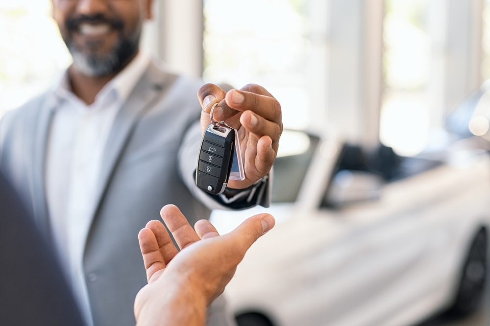 Man hands over car keys