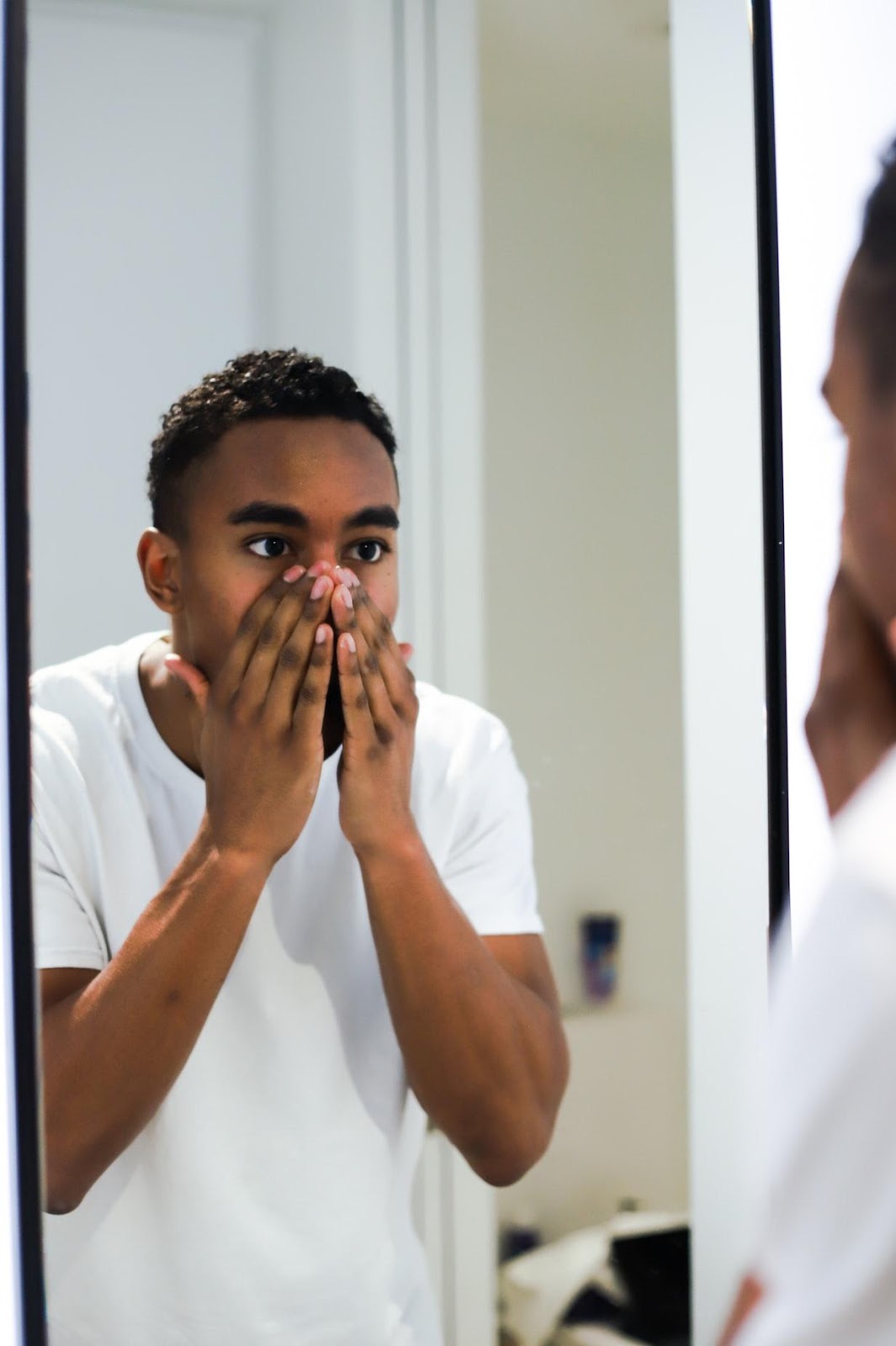 man washing his face