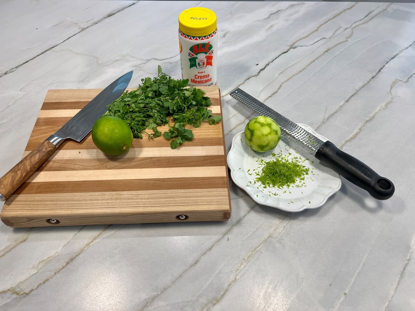 the three ingredients: cilantro, limes and crema Mexicana