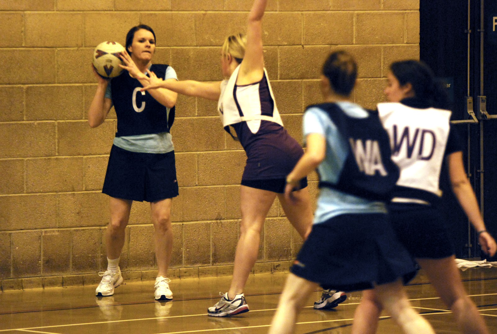 Female netball player in dark