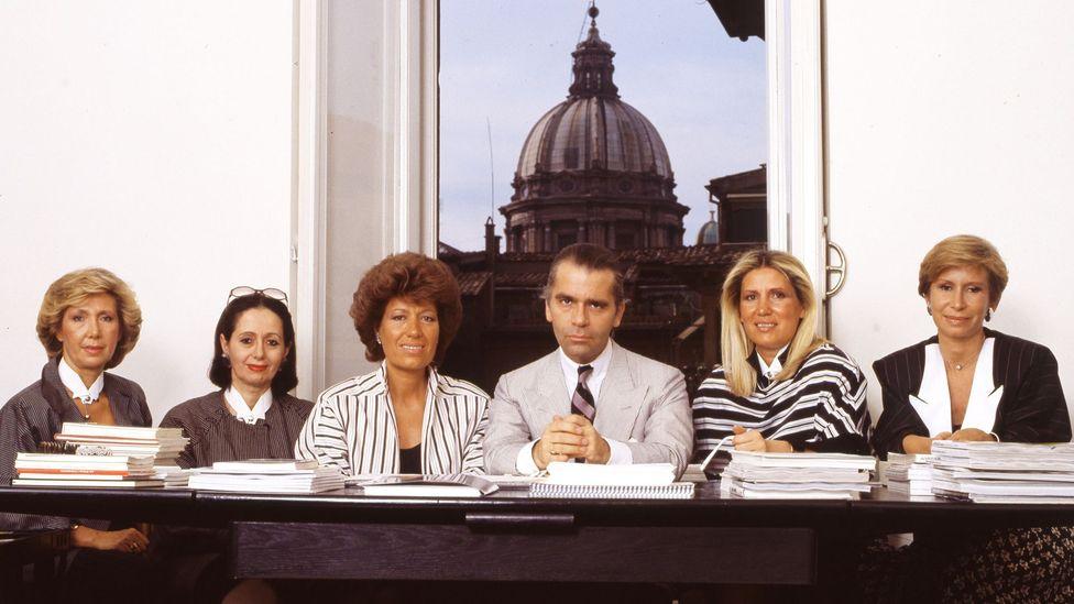 Karl Lagerfeld in 1993, surrounded by the five Fendi sisters, heads of the Italian luxury fashion house (Credit: Getty)