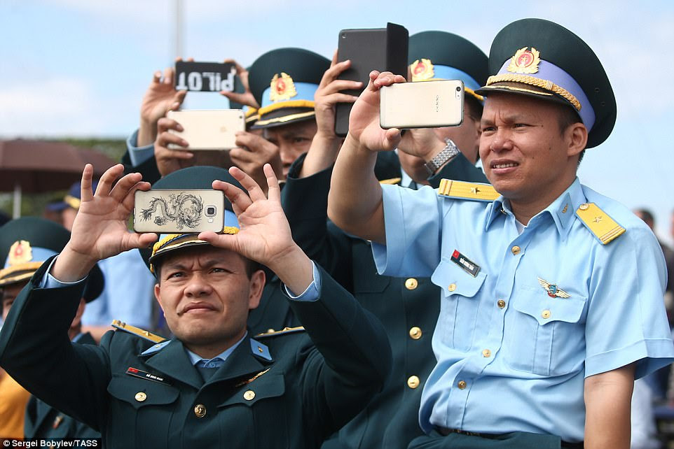 Servicemen take pictures of the air action. Among the other nations understood to have competed in the past at Aviadarts are Kazakhstan, China, Egypt, Iran, Venezuela, Zimbabwe, Kuwait and Mongolia