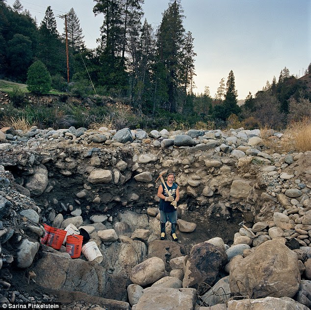 Treasure hunting: Avery in his digging hole by the Scott River, Klamath National Forest, California, 2009