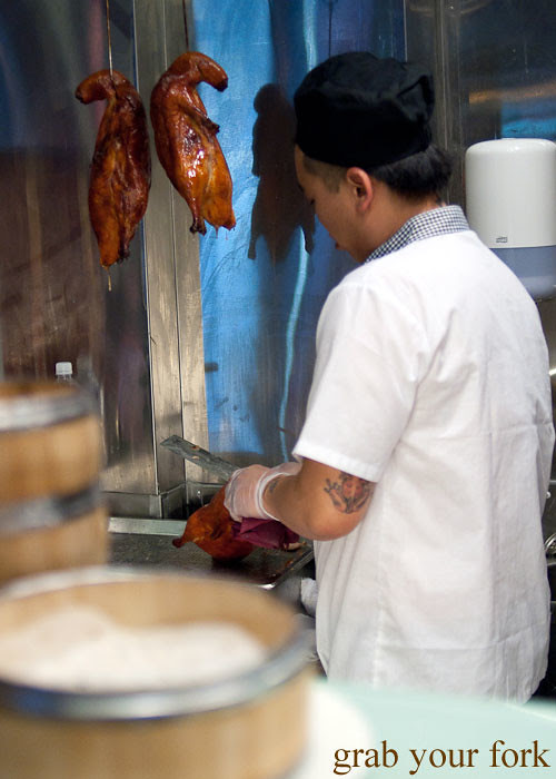 chef carving roast duck