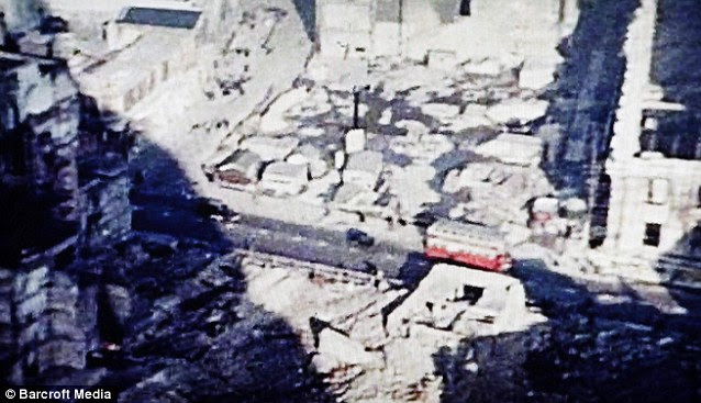 These images, above and below, show terrible bomb damage in the shadow of St Pauls Cathedral  in the heart of the City of London