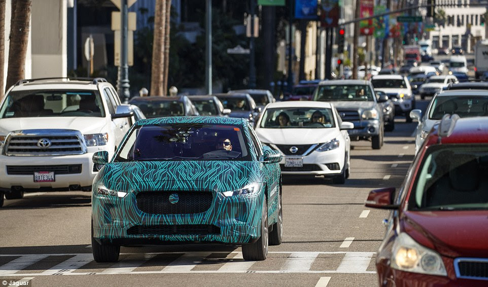 The car was hard to miss driving along Sunset Boulevard in Los Angeles in this electric-shock camouflage, designed to hide the styling features of the vehicle