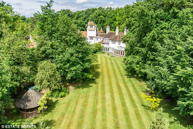 Leafy abode: Galewood House near Cambridge is on the market at £1.65million