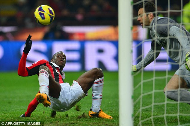 Whoops: Mario Balotelli can't make the contact with the ball he desires and Samir Handanovic collects it