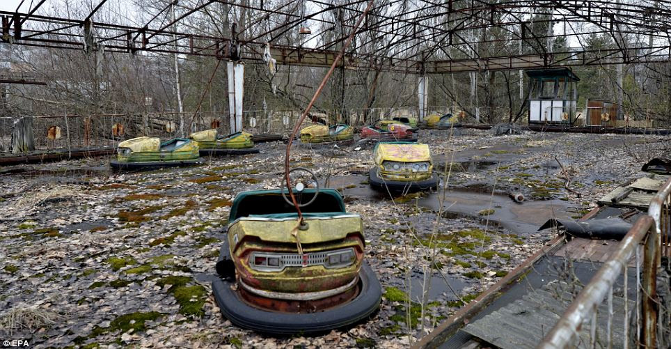 Bumper cars riddled with rust sit in a fairground in Pripyat. A 19-mile area around the plant has been largely uninhabited since the nuclear leak