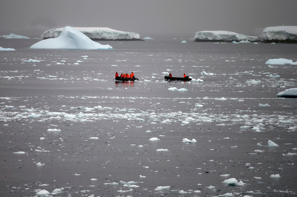 Description of . In this Jan. 22, 2015 photo, Chilean Navy officers transport scientists to Chile's Station Bernardo O'Higgins in Antarctica. Because there is no local industry, any pollution captured in the pristine ice and snow is from chemicals that traveled from afar, such as low levels of lead found in ice until it was phased out of gasoline, or radiation levels found from above-ground nuclear tests thousands of miles away and decades ago by the U.S. and the Soviet Union, according to David Vaughan, science director of the British Antarctic Survey. (AP Photo/Natacha Pisarenko)