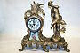 Figural clock with outside escapement.
