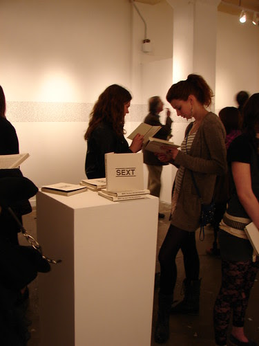 People reading/ SEXT book display