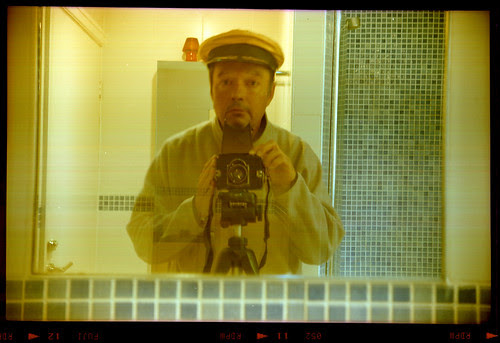 reflected self-portrait with K W Box-Reflex camera and gold cap by pho-Tony