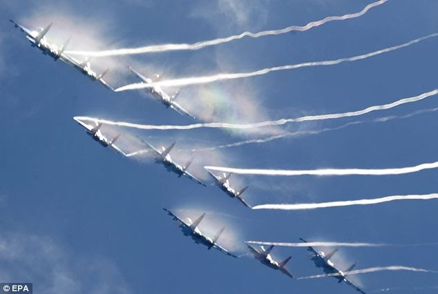 The Russian Air Force acrobatics demonstration teams 'Russian Knights' and 'Swifts' perform during the opening of the International Aviation and Space salon MAKS 2013