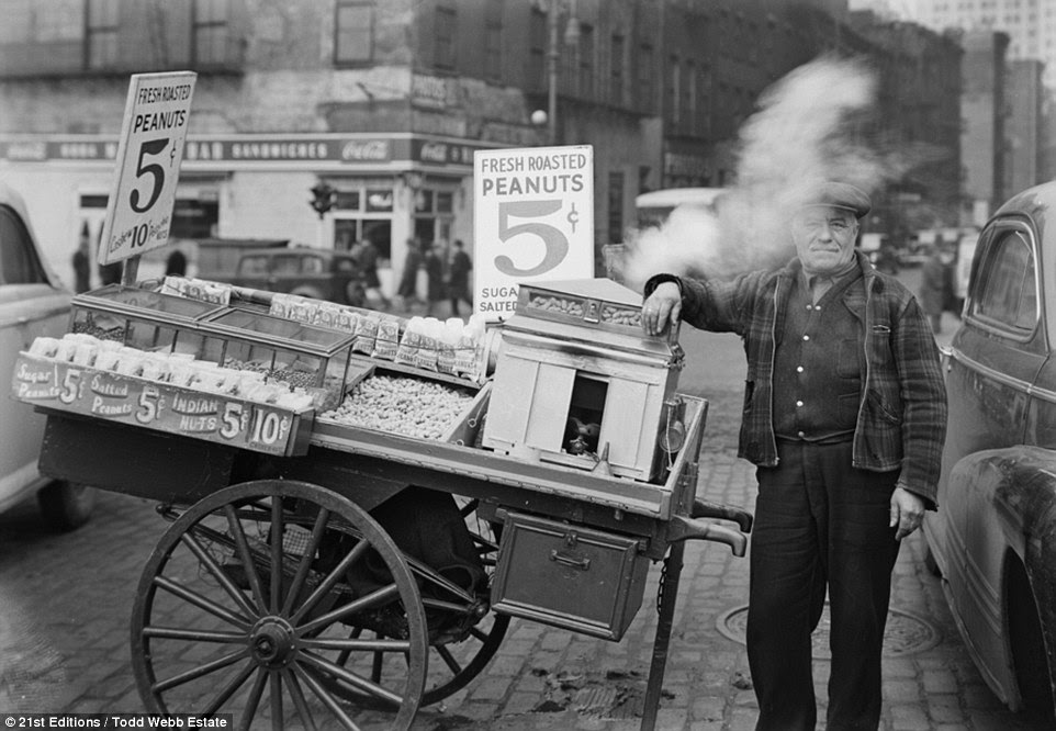 Working man: Taken close to Battery Park in downtown Manhtattan, this image shows a local tradesman selling roasted peanuts on the street for five cents a bag