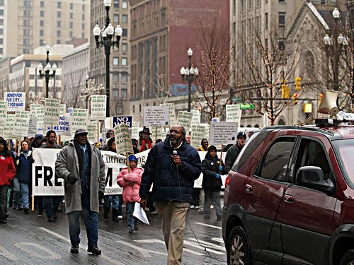 Abayomi Azikiwe, editor of the Pan-African News Wire, holding microphone at Detroit MLK Day March on Washington Blvd. downtown, January 15, 2007. (Photo: Robert Akrawi). by Pan-African News Wire File Photos