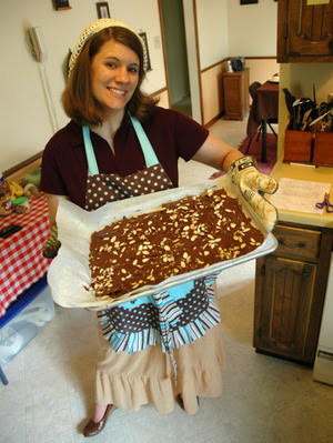 In deference to Titus 2:3-5 and 1 Timothy 5:14, Rachel Held Evans tried to stay "busy in the home," honing her cooking, cleaning and hospitality skills. She is seen here with homemade matzah toffee for Passover. In deference to Titus 2:3-5 and 1 Timothy 5:14, Rachel Held Evans tried to stay "busy in the home," honing her cooking, cleaning and hospitality skills. She is seen here with homemade matzah toffee for Passover.