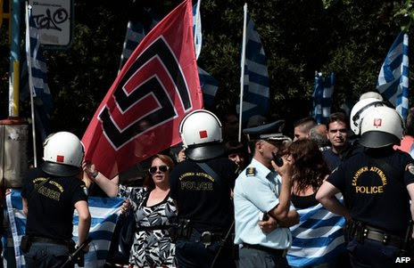 Golden Dawn supporters wave flags in Athens, 2 October
