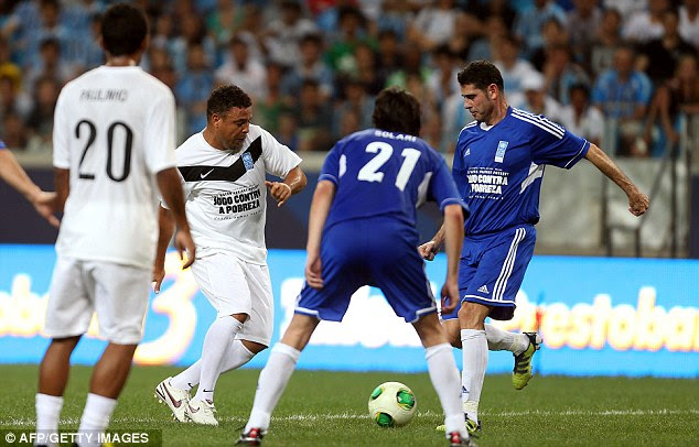 Collision course: Ronaldo and Fernando Hierro go in for a 50-50