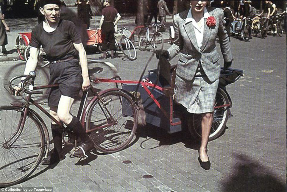 A smartly dressed woman steps from a bicycle taxi: Nazi Propaganda Minister Joseph Goebbels wanted Paris to retain its pre-war image, at least on the surface