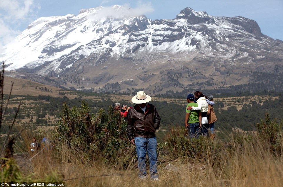 As it is now: Tourists and visitors flock to enjoy the sight of the volcano in the 21st century. The four-capped peak remains a huge draw for people from across the world