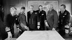 British Task Force chiefs inspect a map of South America