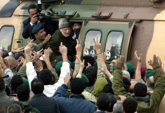 Former Palestinian President Yasser Arafat (C) enters a helicopter as he leaves his compound in the West Bank city of Ramallah, in this October 29, 2004 file picture. REUTERS-Ammar Awad-Files