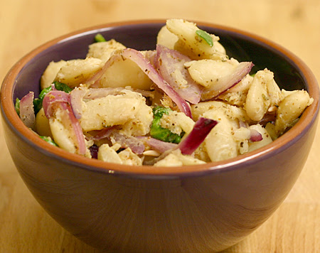 Warm butter bean, red onion, and spinach salad with mustard